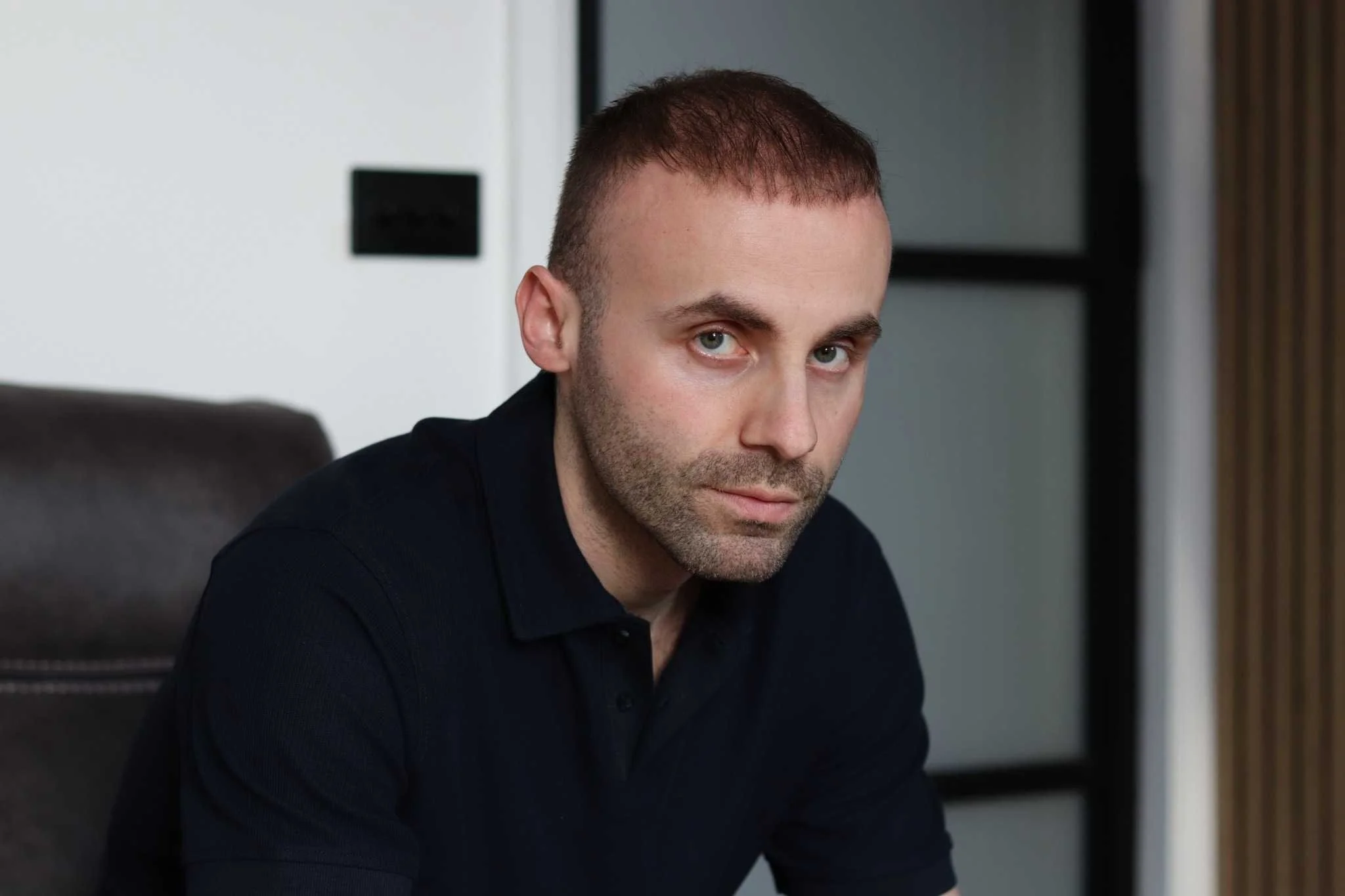 iain myles seated indoors in london, UK