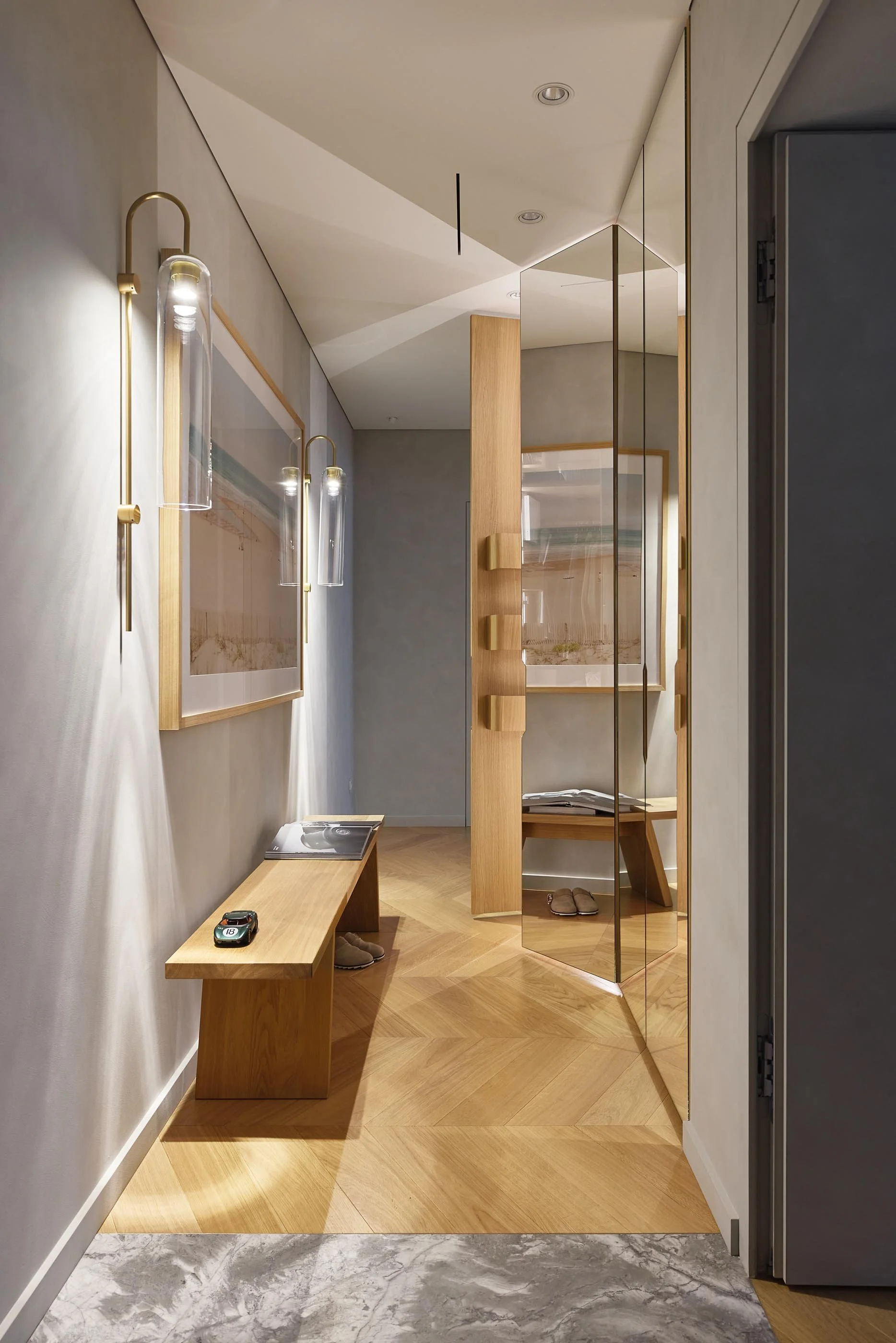 Built-In Oak Desk Nook with Illuminated Shelves and Mirrored Back Panel
