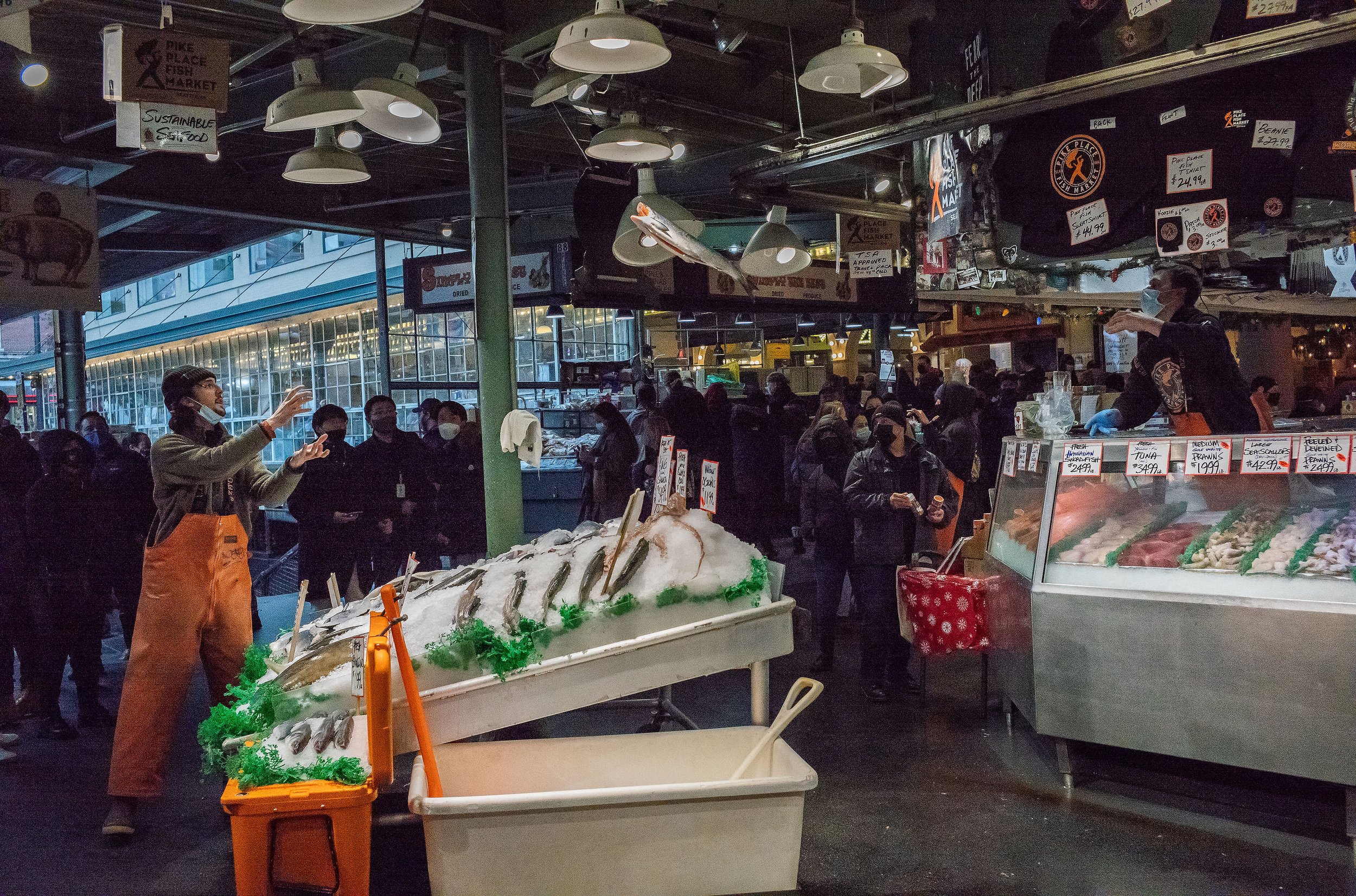  A silver (coho) salmon from Alaska is thrown at Pike Place Market in Seattle, Washington, USA on December 4, 2021. 