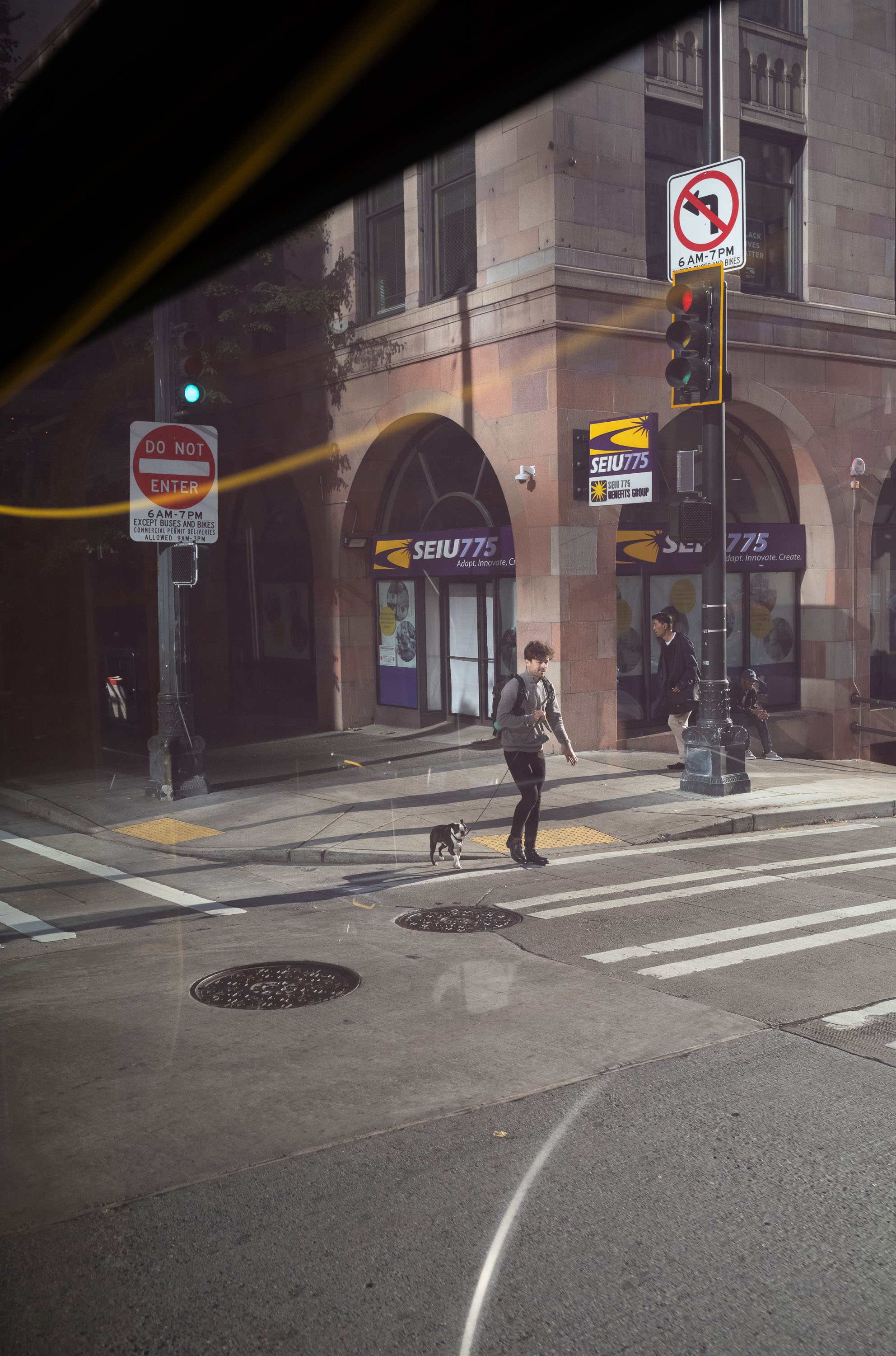  A union office and pedestrian are seen from a bus traveling south through downtown Seattle, Washington, USA on October 5, 2023. 