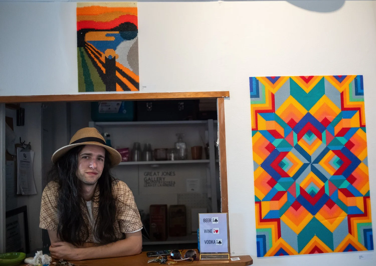  Max W. stands with Valerie Calano’s work at The Factory gallery on June 9, 2024 on Capitol Hill in Seattle, Washington, USA. 