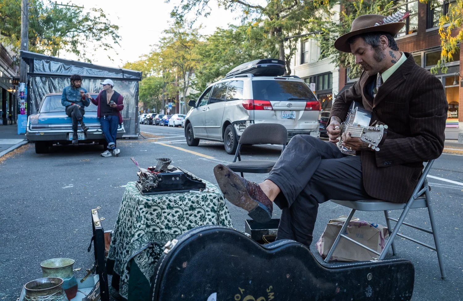  Poet Dusty Oliver plays guitar in Ballard in Seattle, Washington, USA on September 11, 2024. 
