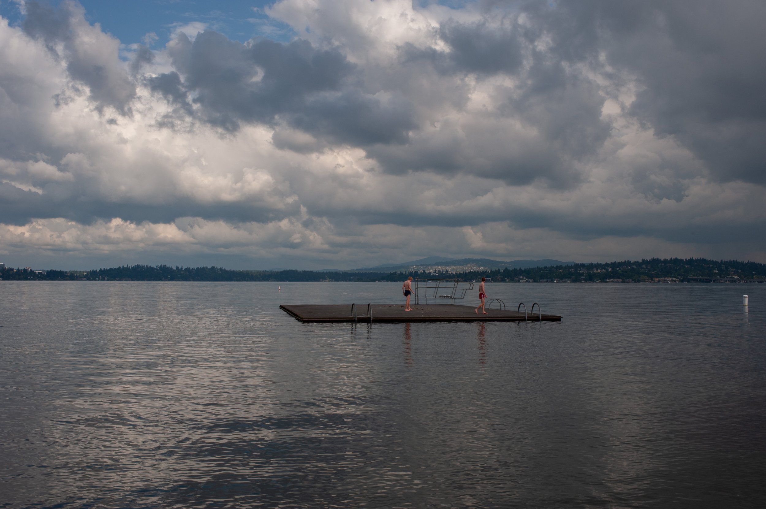  Long distance runners from Seattle University stop for a swim in Lake Washington in Seattle, Washington, USA on May 31, 2011. 