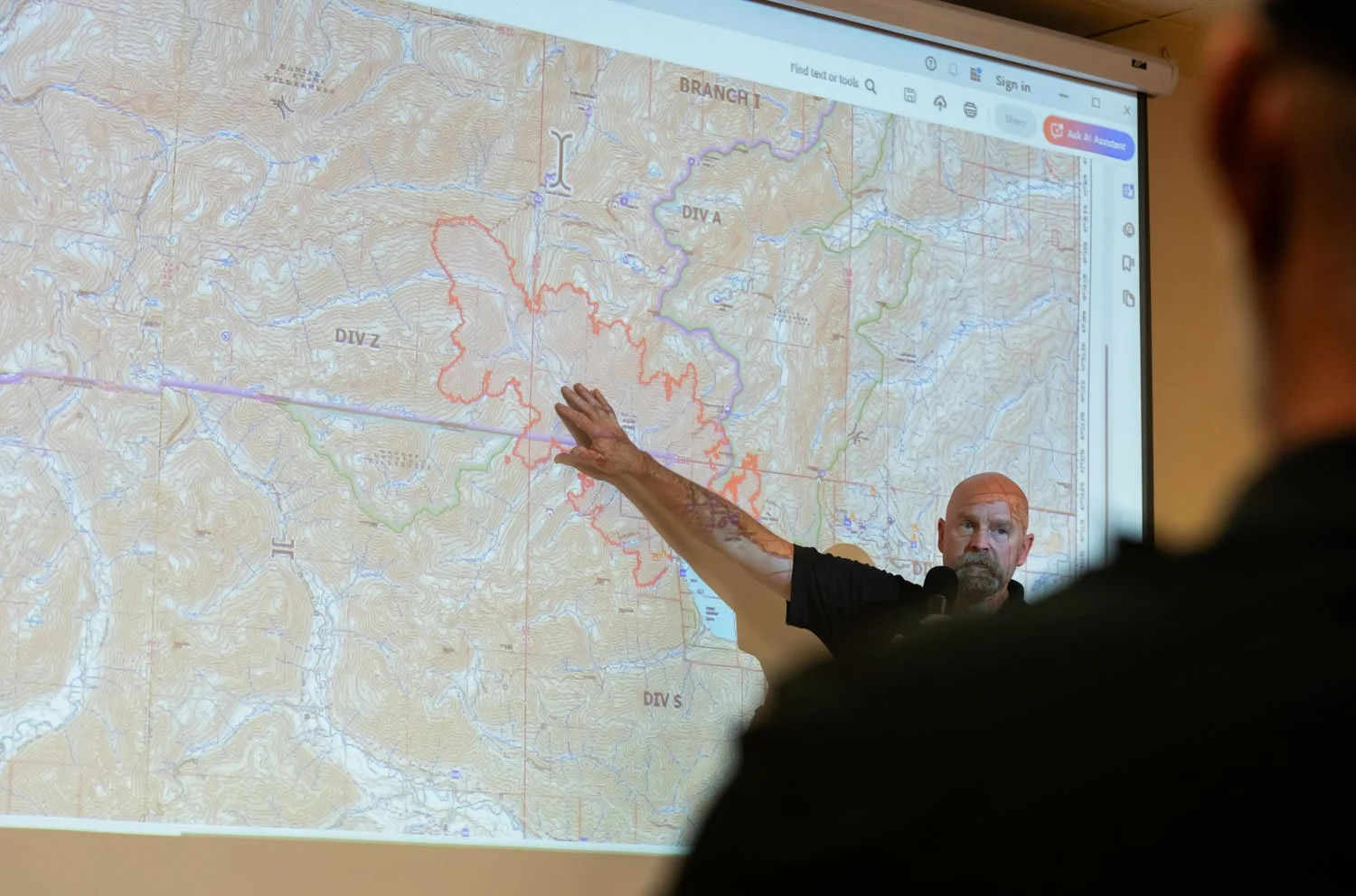 Operations Section Chief Travis Ederer of California Team 7  speaks at the Bear Gulch Fire Town Hall Meeting in Hoodsport, Washington, USA on August 21, 2025.