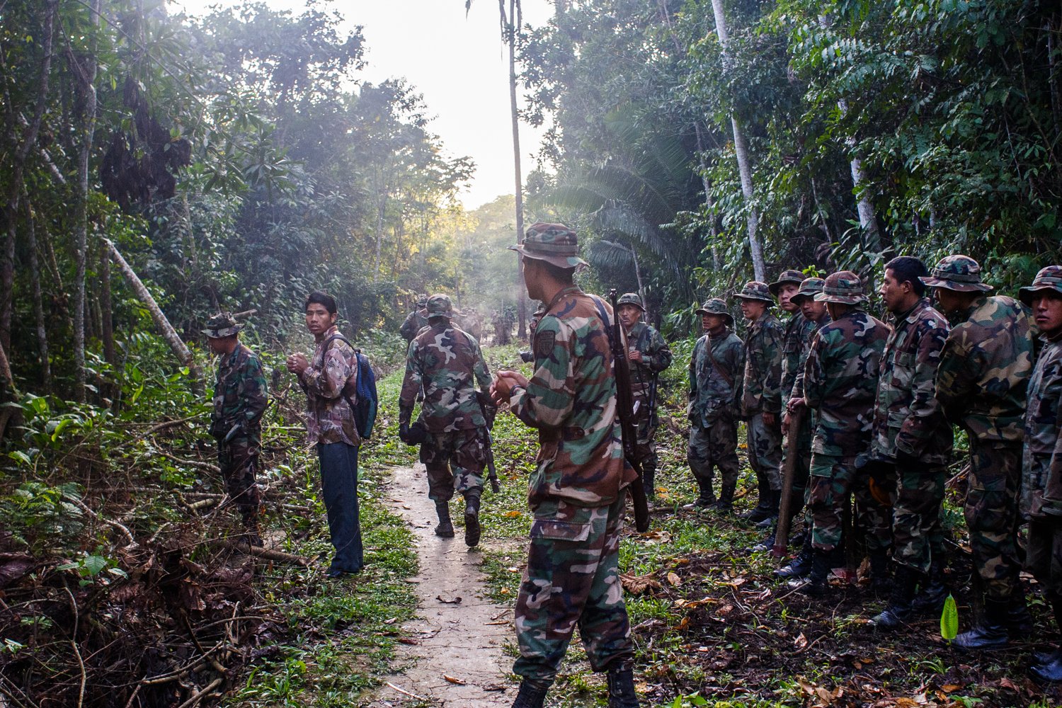 A cocalero waits with an eradication crew in the Chapare of Bolivia on August 10, 2005.