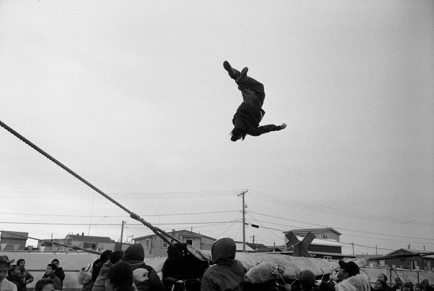 Backflip during the blanket toss at an annual Nalukataq whaling festival on June 26th, 2015 in Barrow, or Utqiaġvik, Alaska.