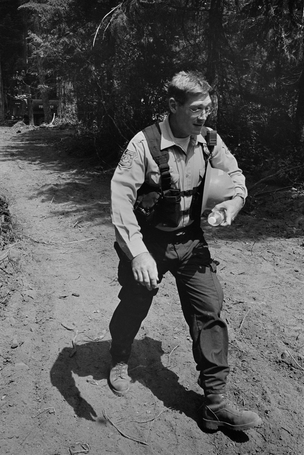 A National Forest law enforcement officer works to diffuse a stand-off at a tree-sit in the Willamette National Forest of Oregon, USA in 2003.