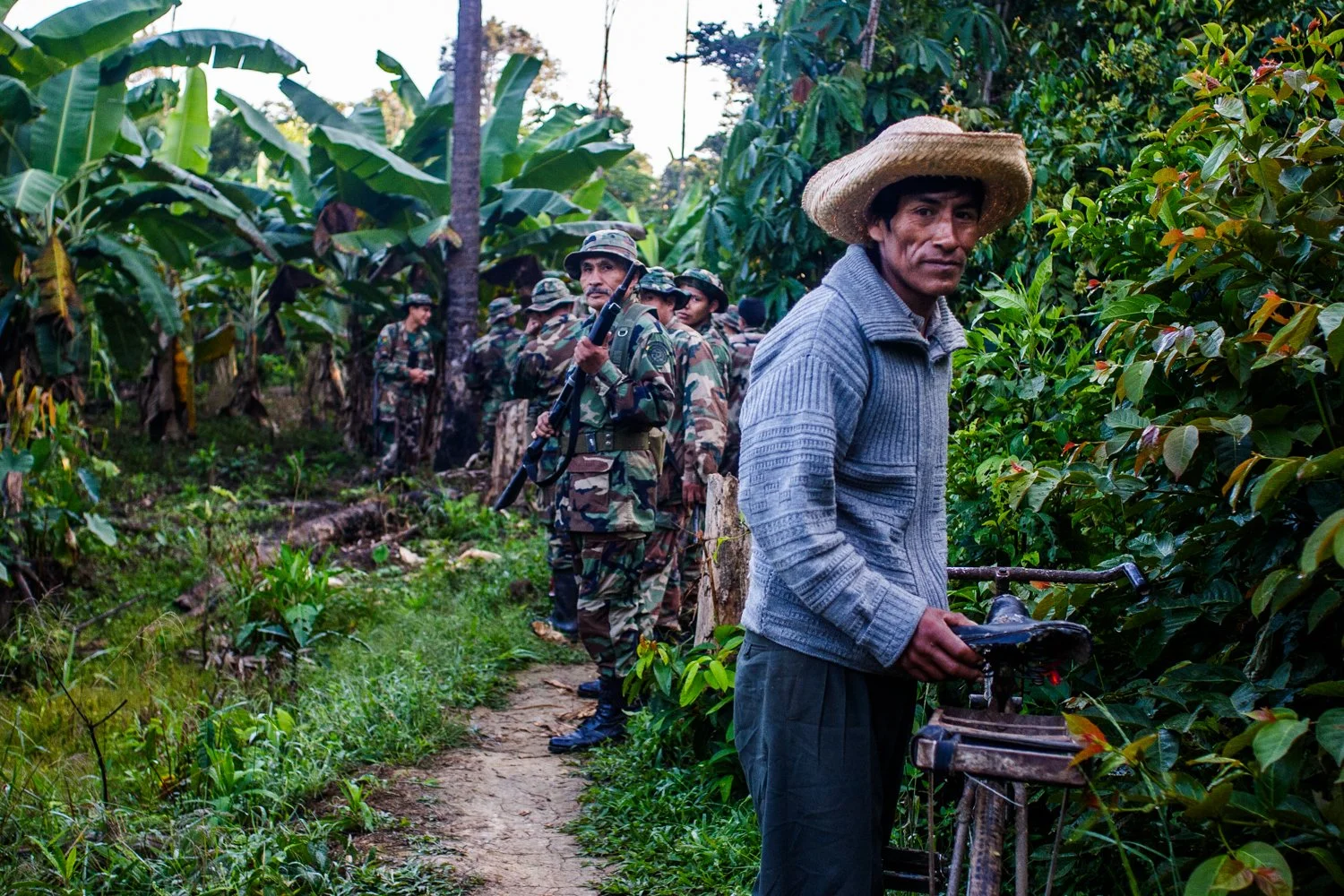 A cocalero and coca eradication crew in the Chapare of Bolivia on August 10, 2005.