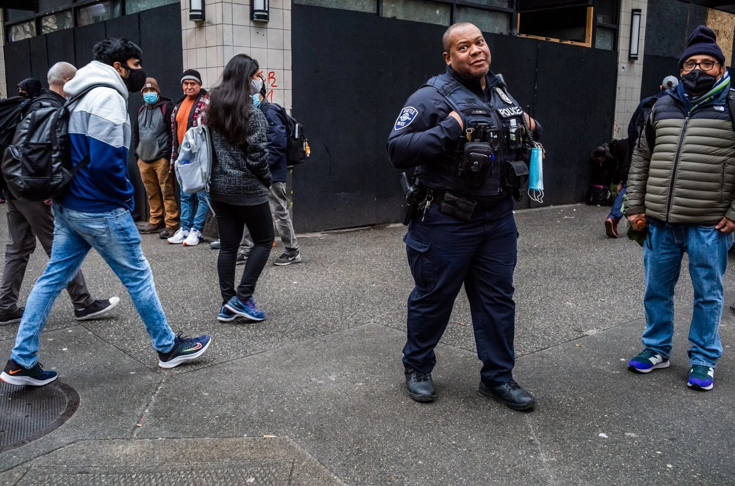 Seattle Police Officer V. Lee patrols on the corner of 3rd Avenue and Pike Street in Seattle, Washington, USA on March 12, 2022.