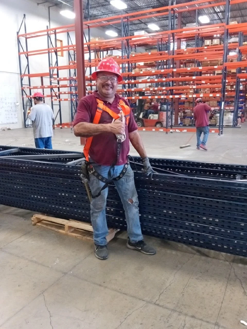 American Erecting installer working on a commercial pallet racking system in Houston