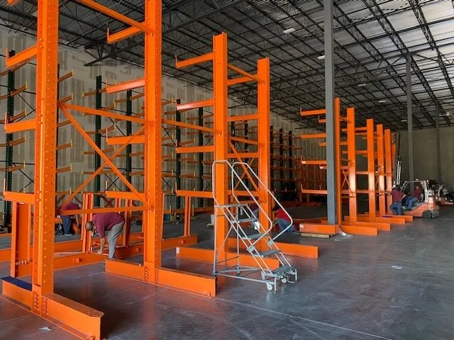 Cantilever racking system configured for efficient industrial warehouse storage