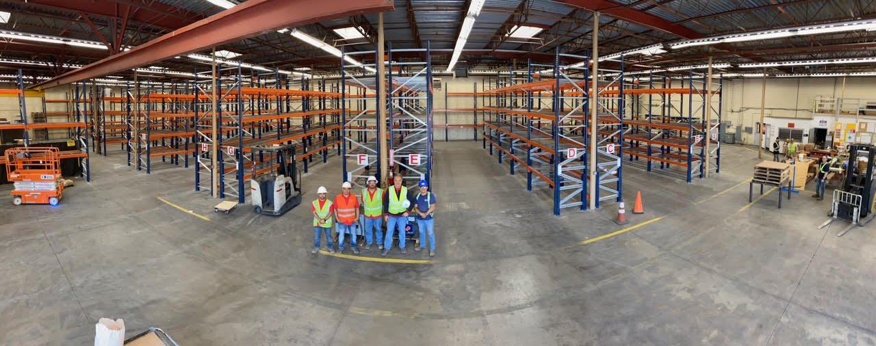 American Erecting crew with a completed warehouse pallet racking installation