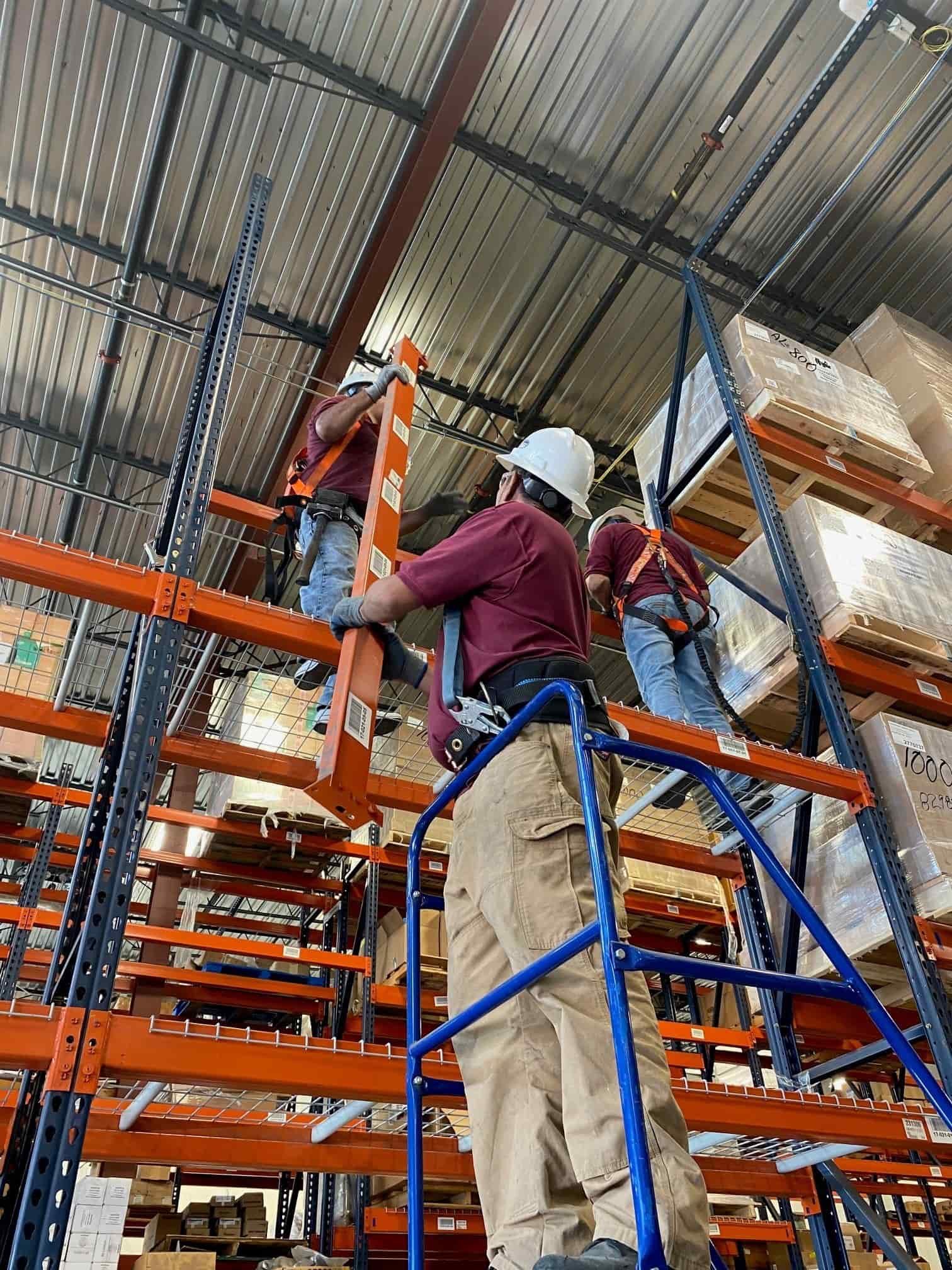 American Erecting crew implementing a planned pallet racking installation in a commercial warehouse