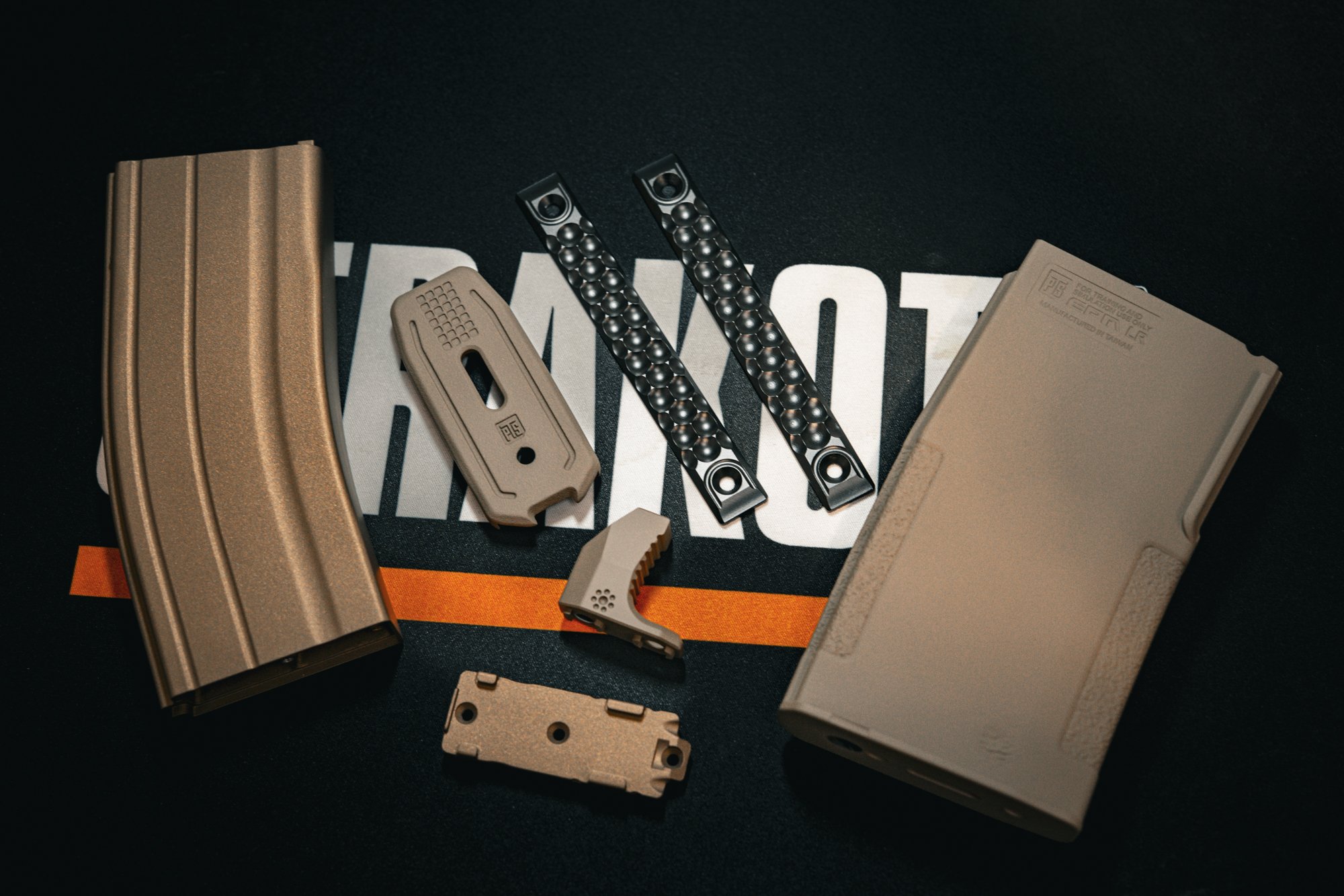 Various airsoft parts in H-148 Burnt Bronze, H-265 FDE & E-100 Blackout