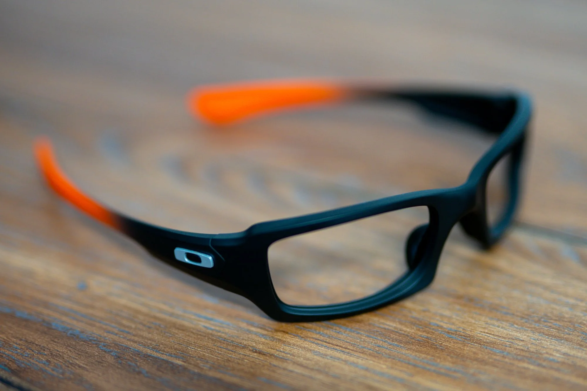 Oakley Sunglasses in H-190 Armor Black with a H-128 Hunter Orange fade 
