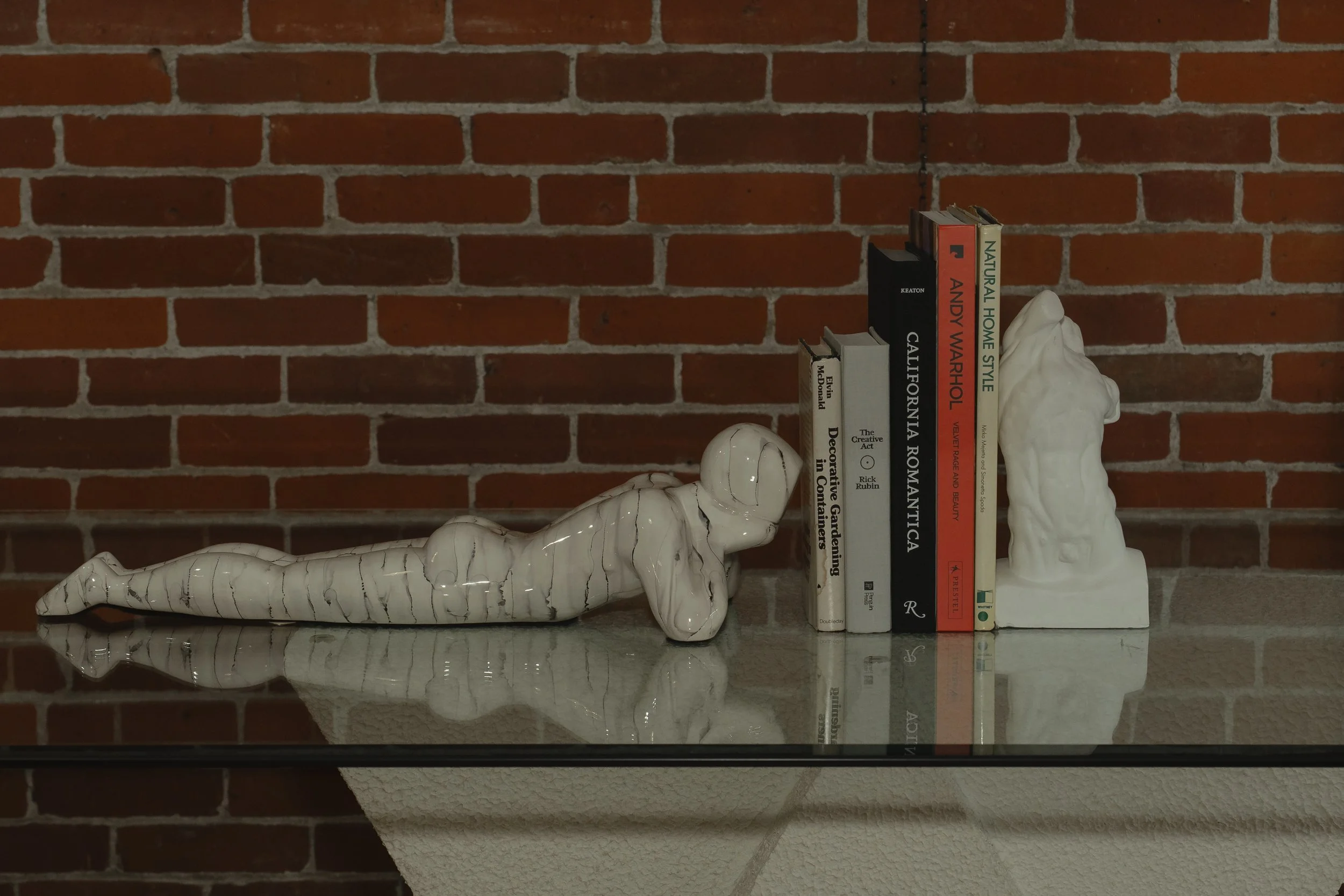 Books and figurines. What more could you want. Doors are open at 12 + shelves are restocked just for you.