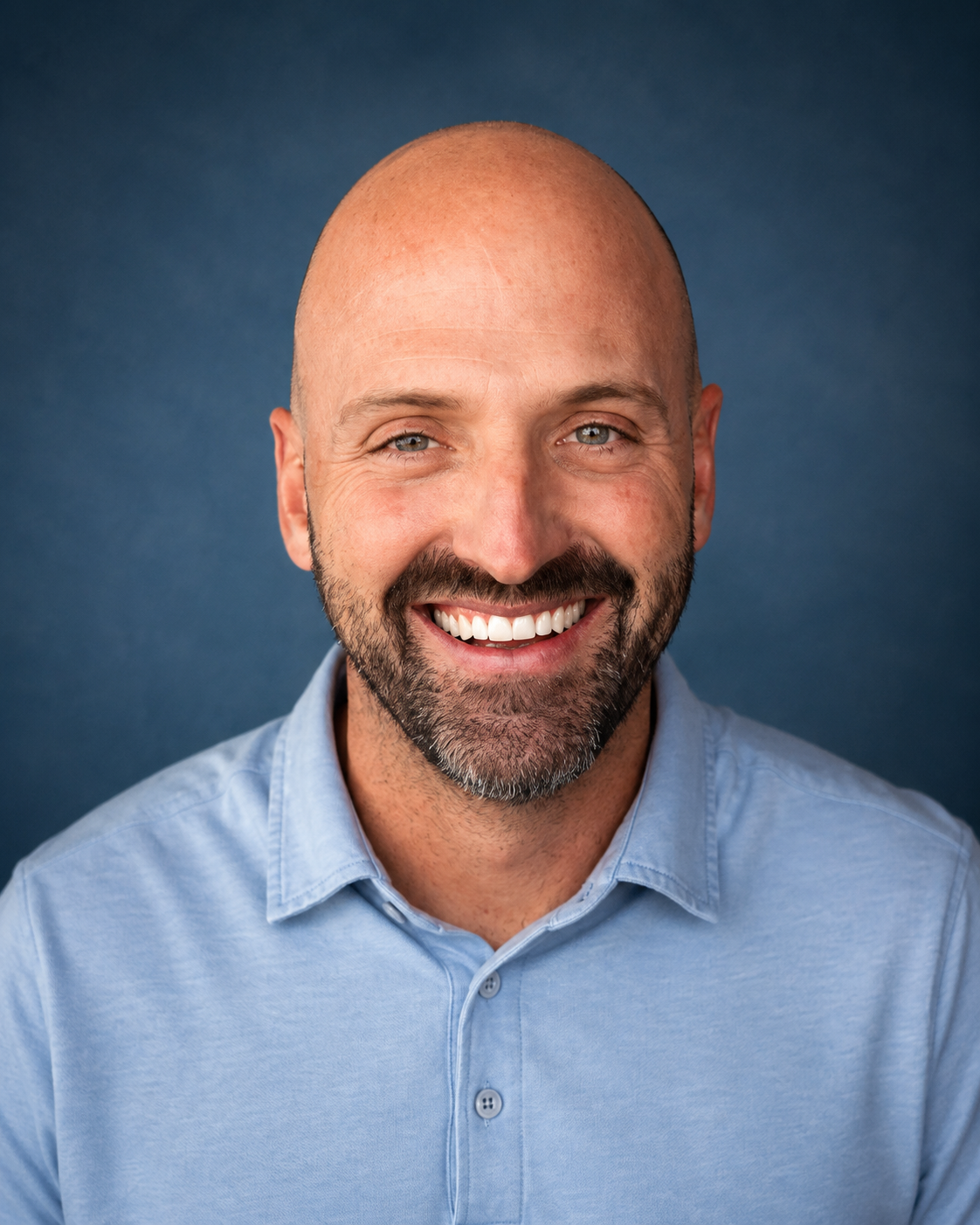 Dr. Ryan Bishop, physical therapist, smiles in professional headshot in CDA Coeur d'Alene, Idaho