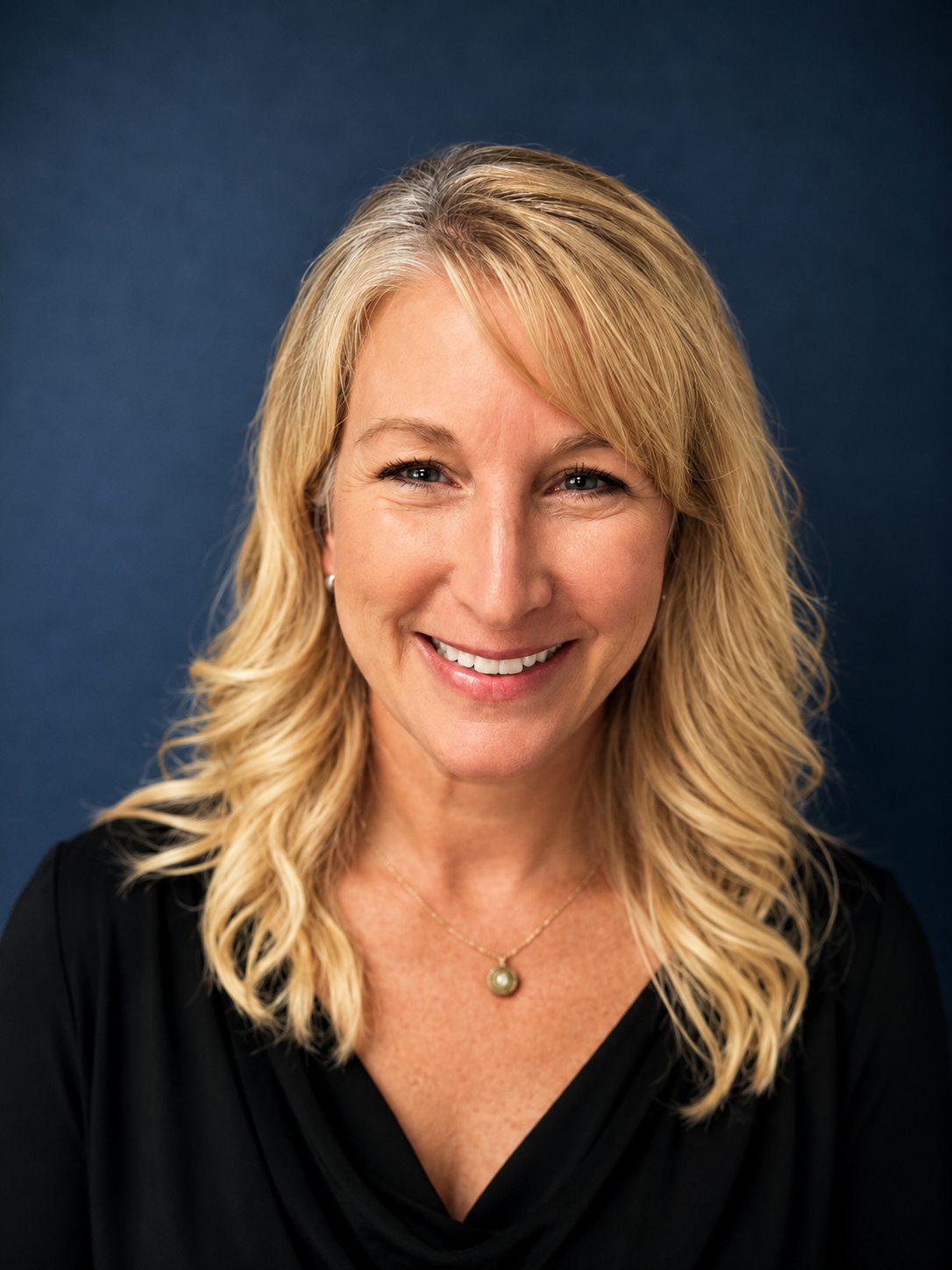 CDA Physcial Therapy Office Coordinator smiles at camera in Coeur d'Alene, Idaho