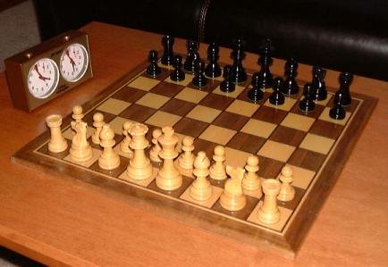 Chess game and play clock with the pieces in their initial position, Wikimedia Commons.
