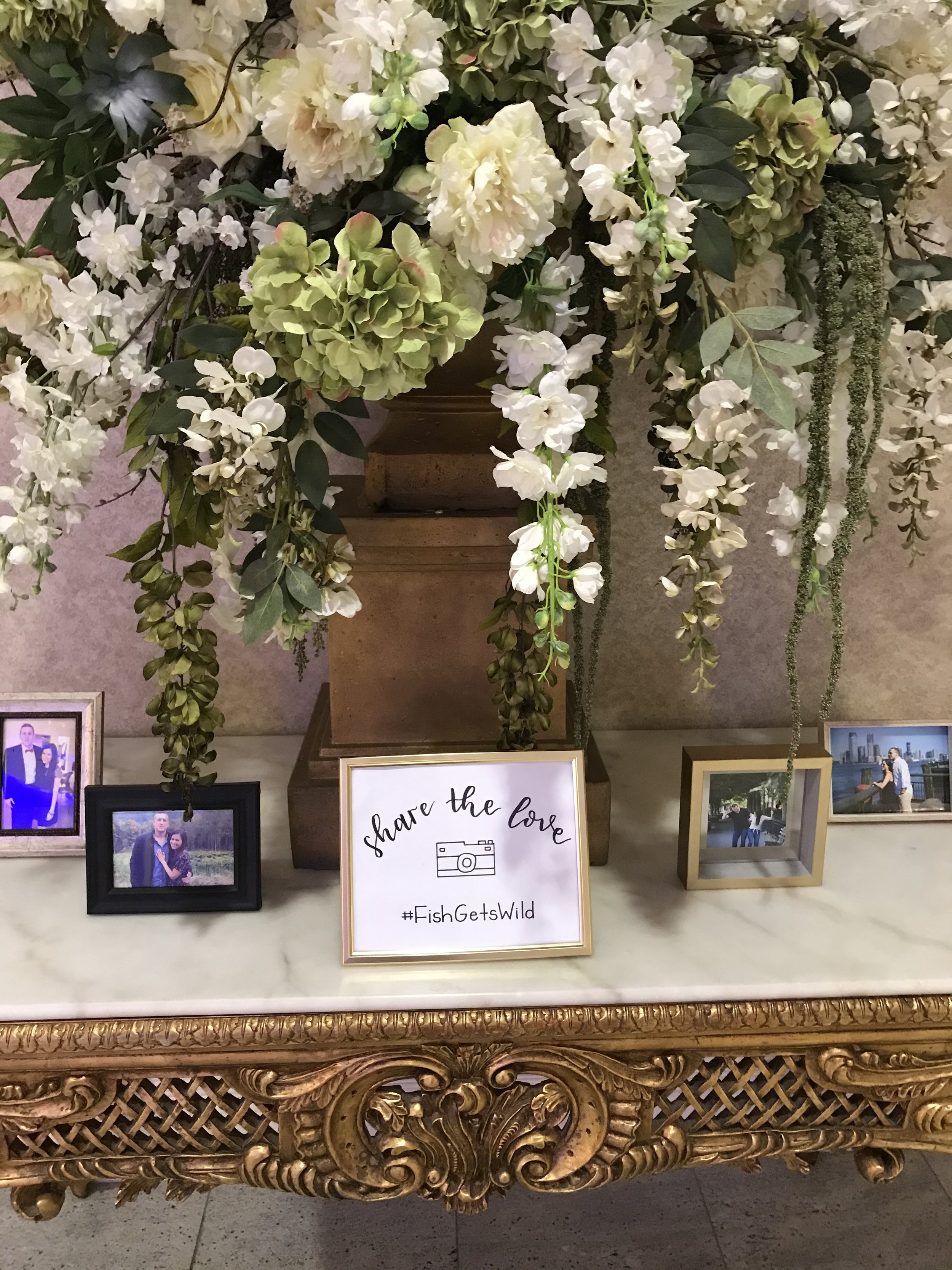 Charming 'Share the Love' sign with whimsical calligraphy, inviting guests to spread joy and well wishes during the wedding celebration.