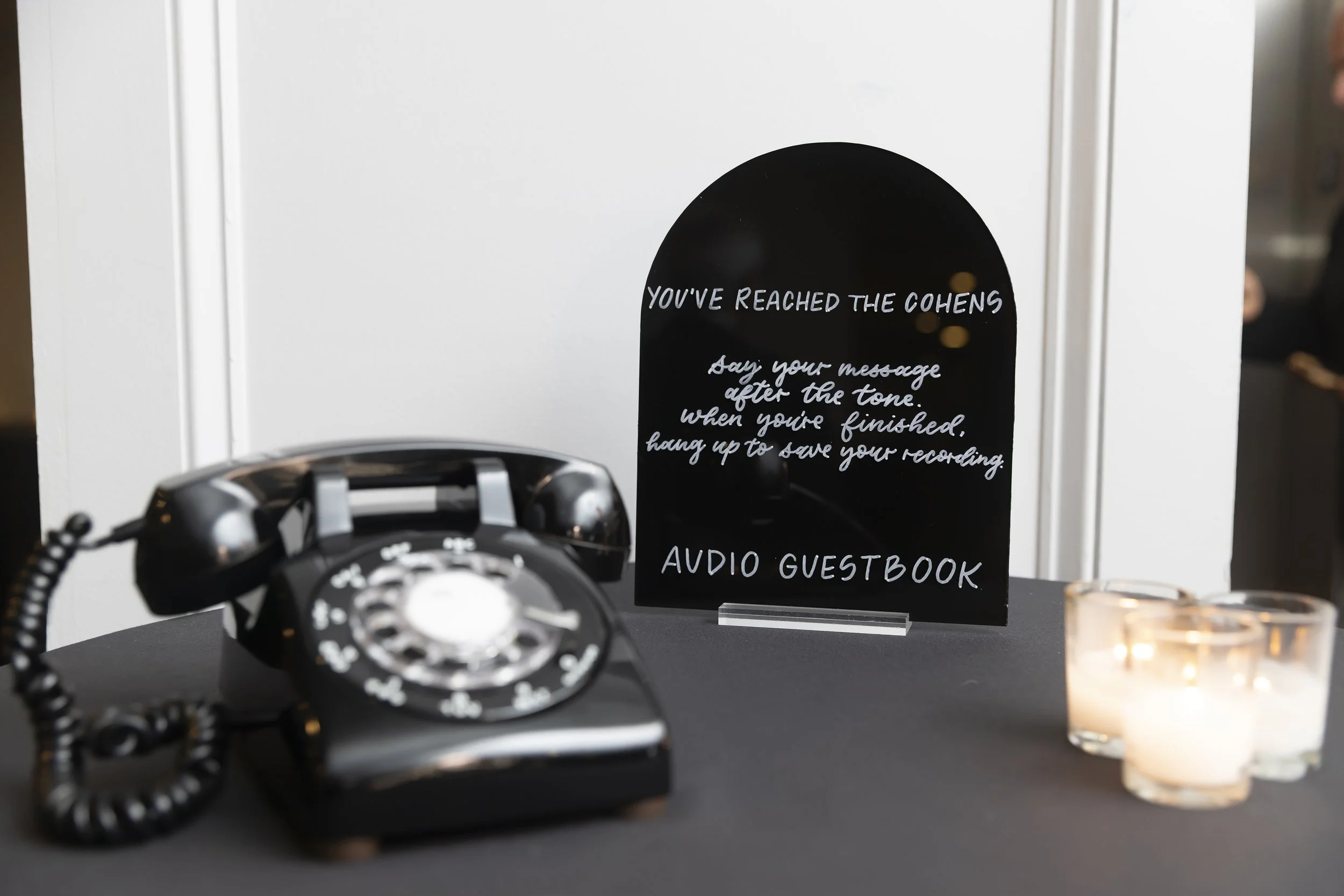 Audio guestbook sign handwritten in modern calligraphy on black arched acrylic for a Jersey City, NJ wedding