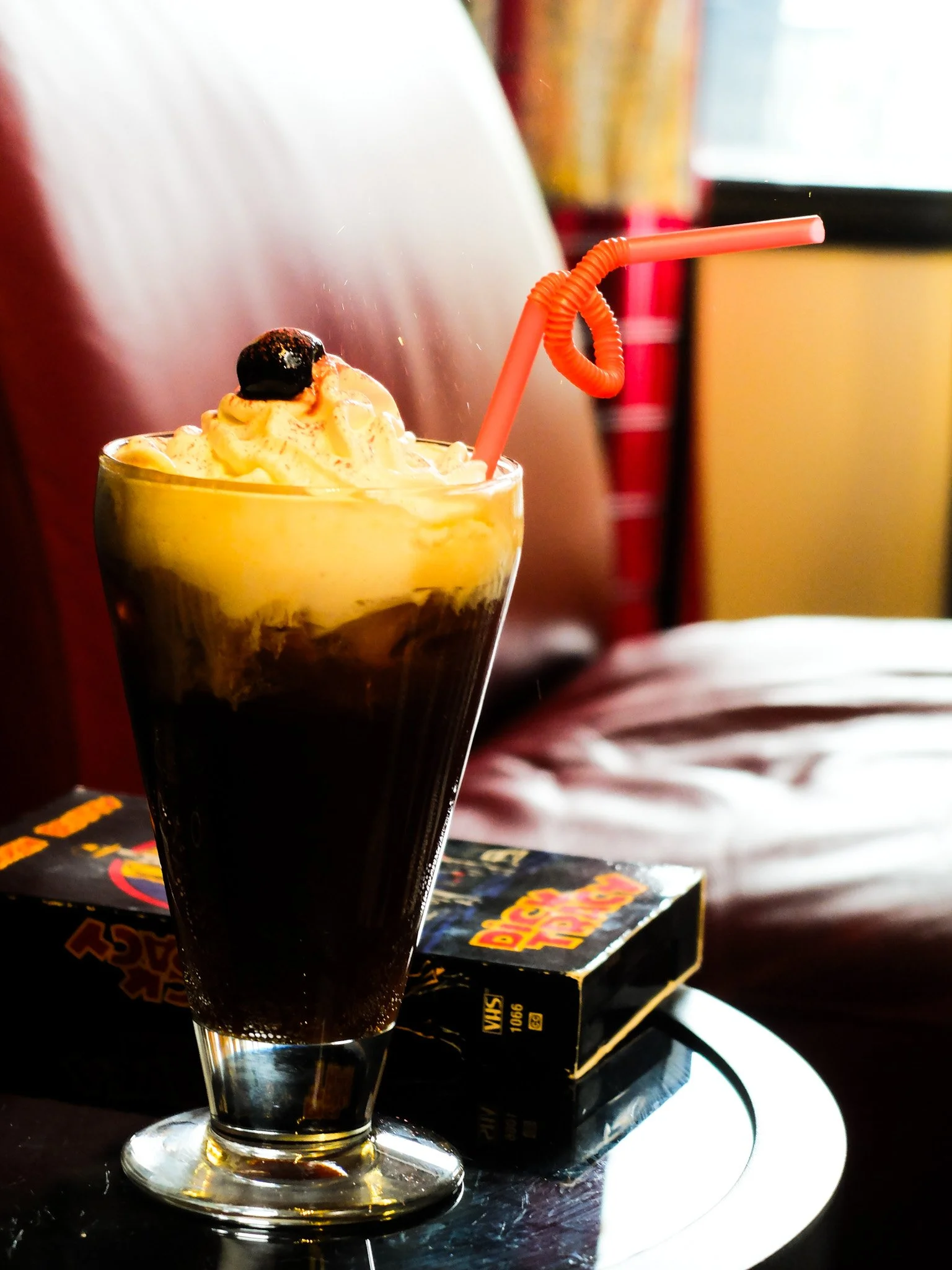 Summer signature drinks in our coffee shop. An espresso soda including espresso, root beer syrup served over sparkling water and topped with a vanilla cream and sprinkles.