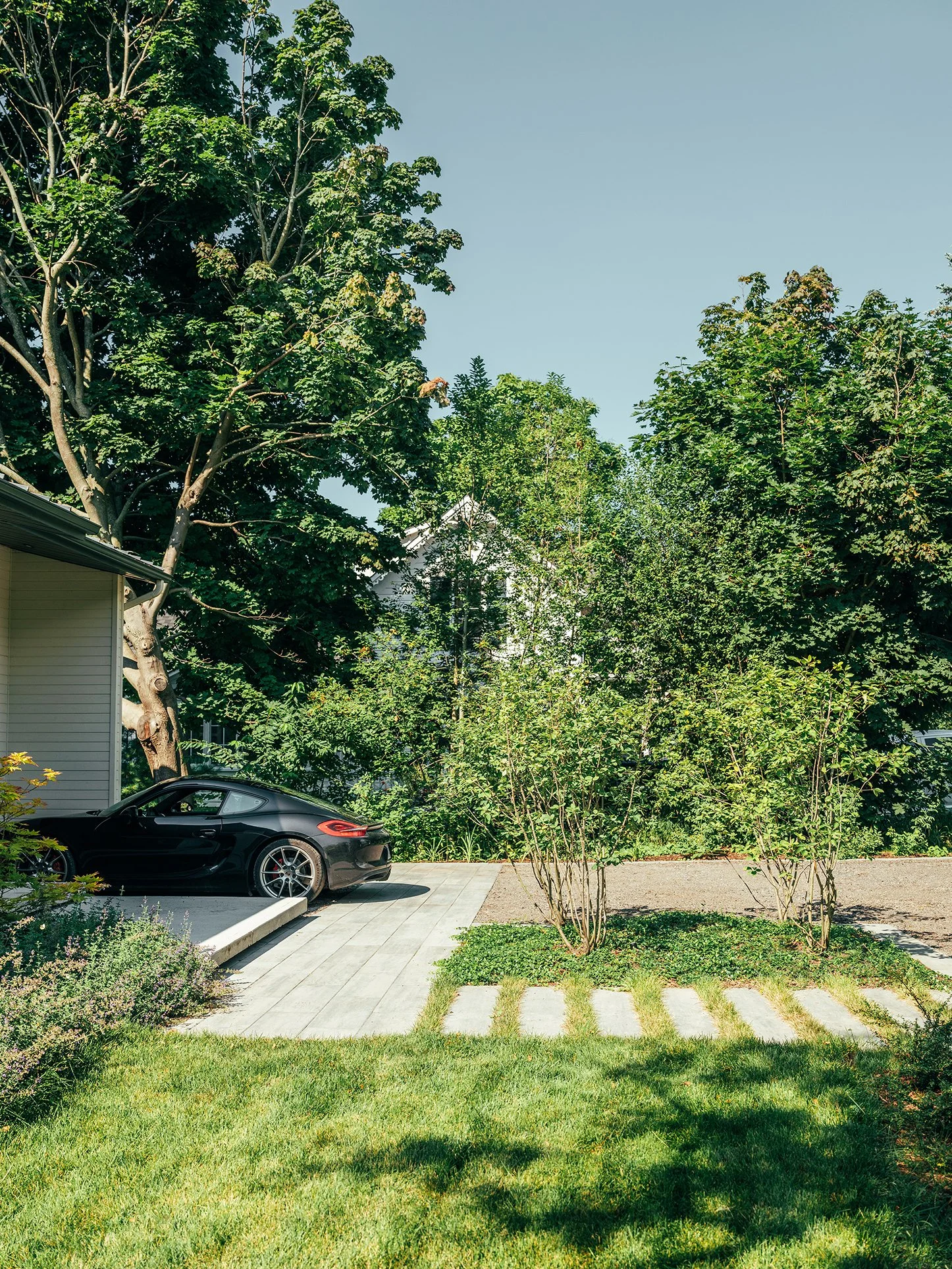 Modern landscape design with parking court