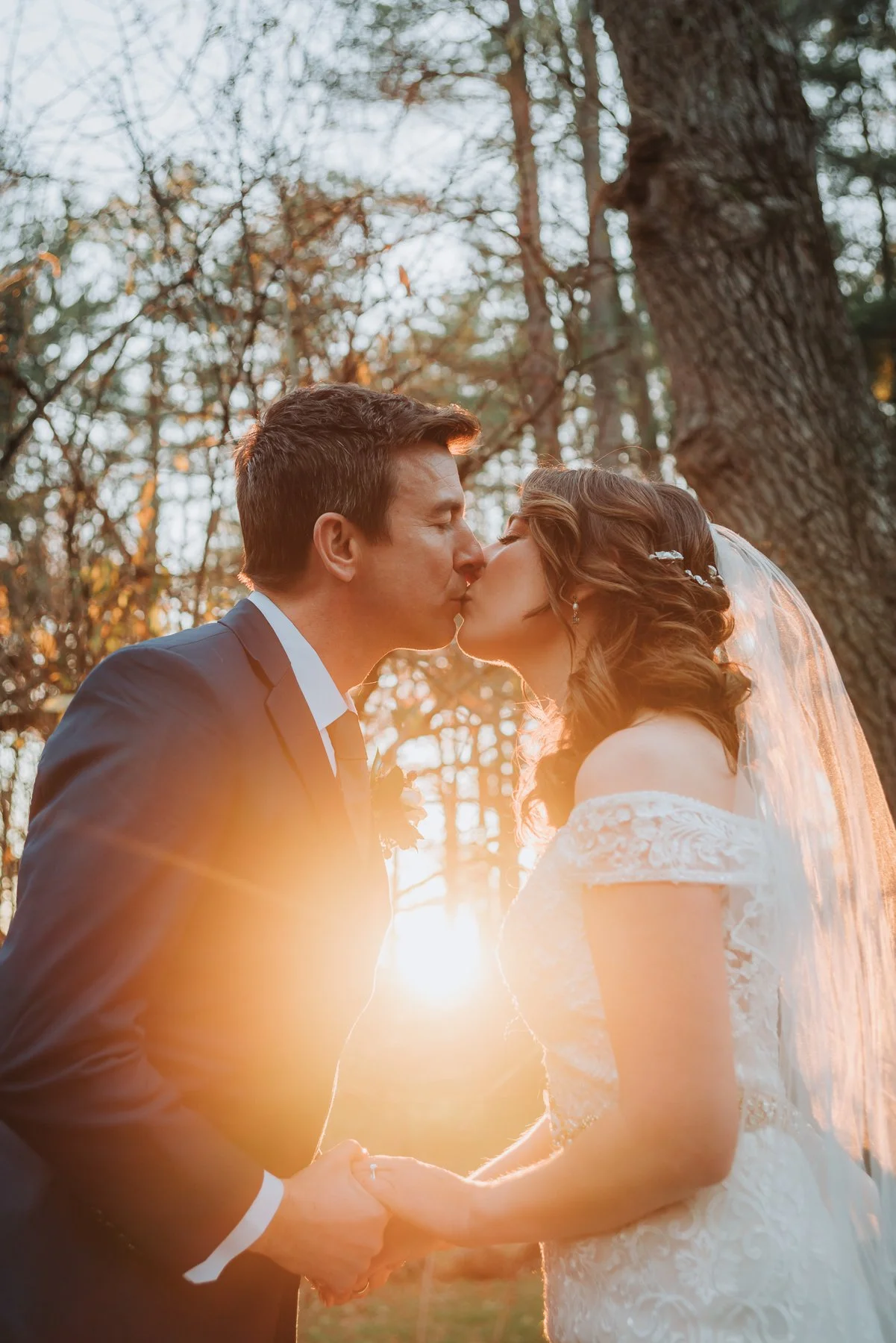 Upstate NY Wedding couple kissing during sunset