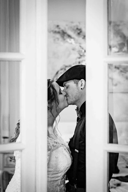 black and white upstate new york wedding couple sharing a kiss