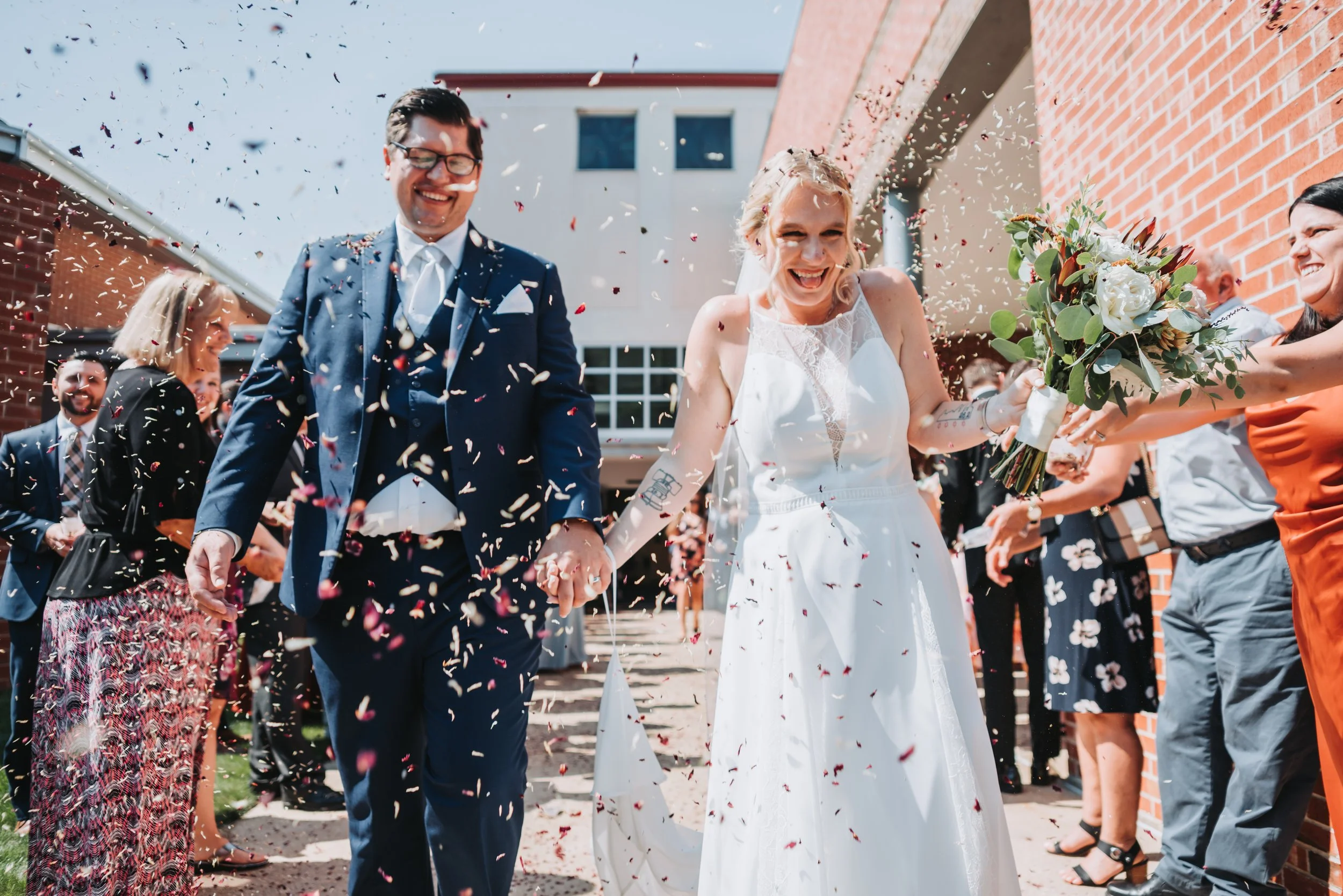 Saratoga Springs NY Wedding Couple getting confetti after the ceremony
