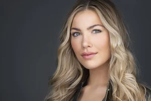 Headshot of a woman with long blonde hair