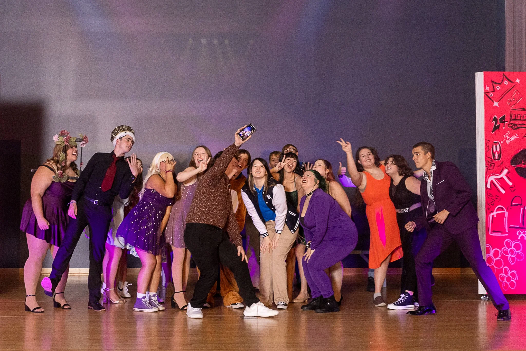The cast of Mean Girls: High School Edition poses for a selfie