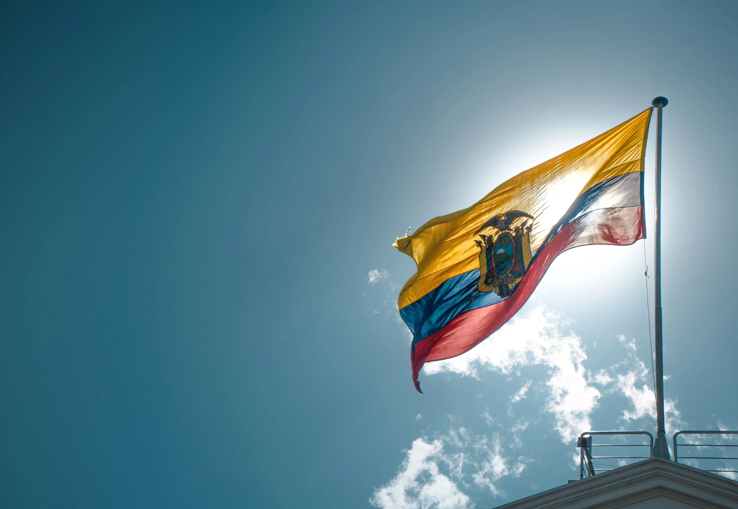 flag-waving-against-blue-sky-with-sun-2026-09-23-13-14-47-utc.jpg