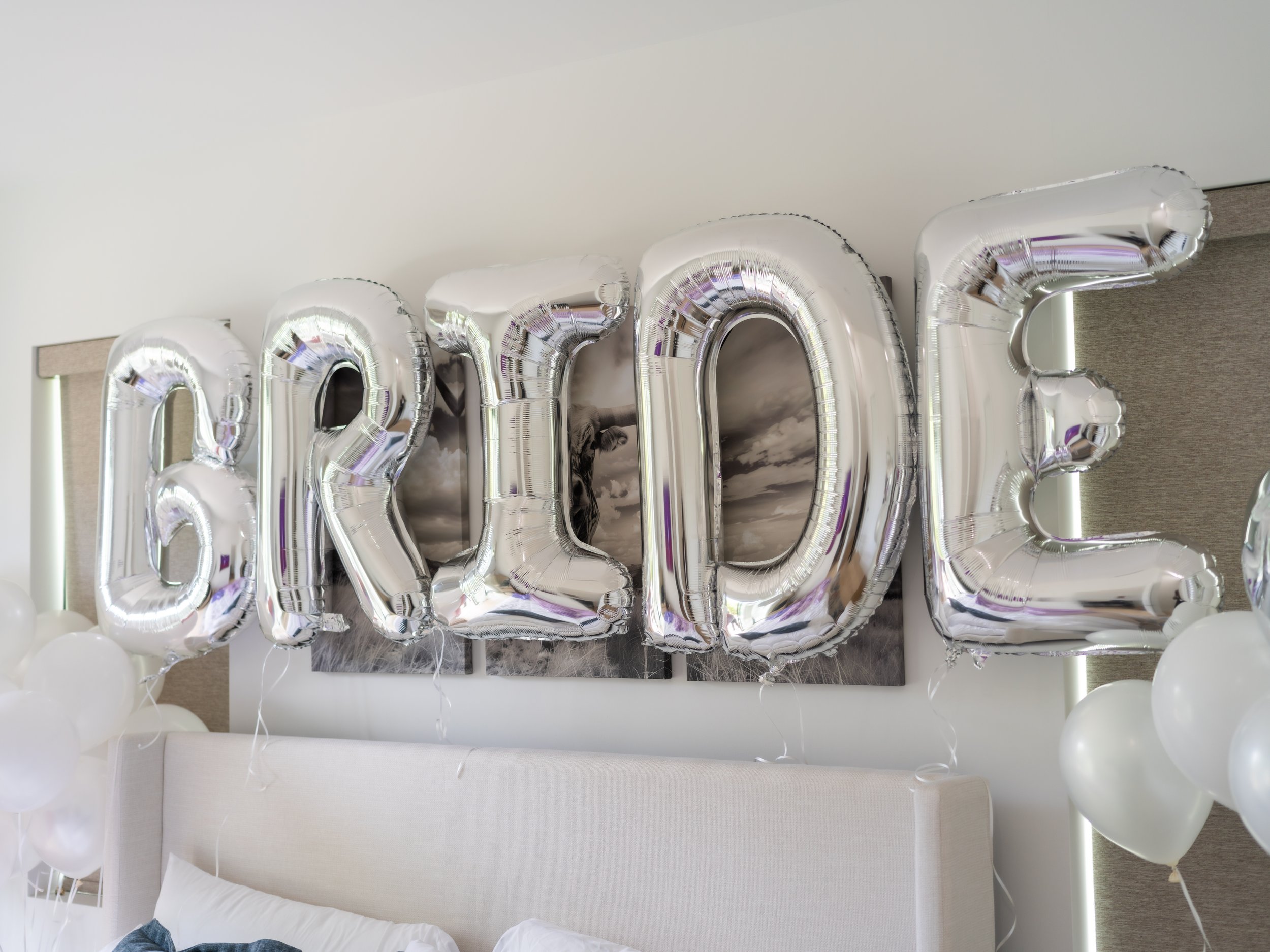 Silver foil balloons spelling out 