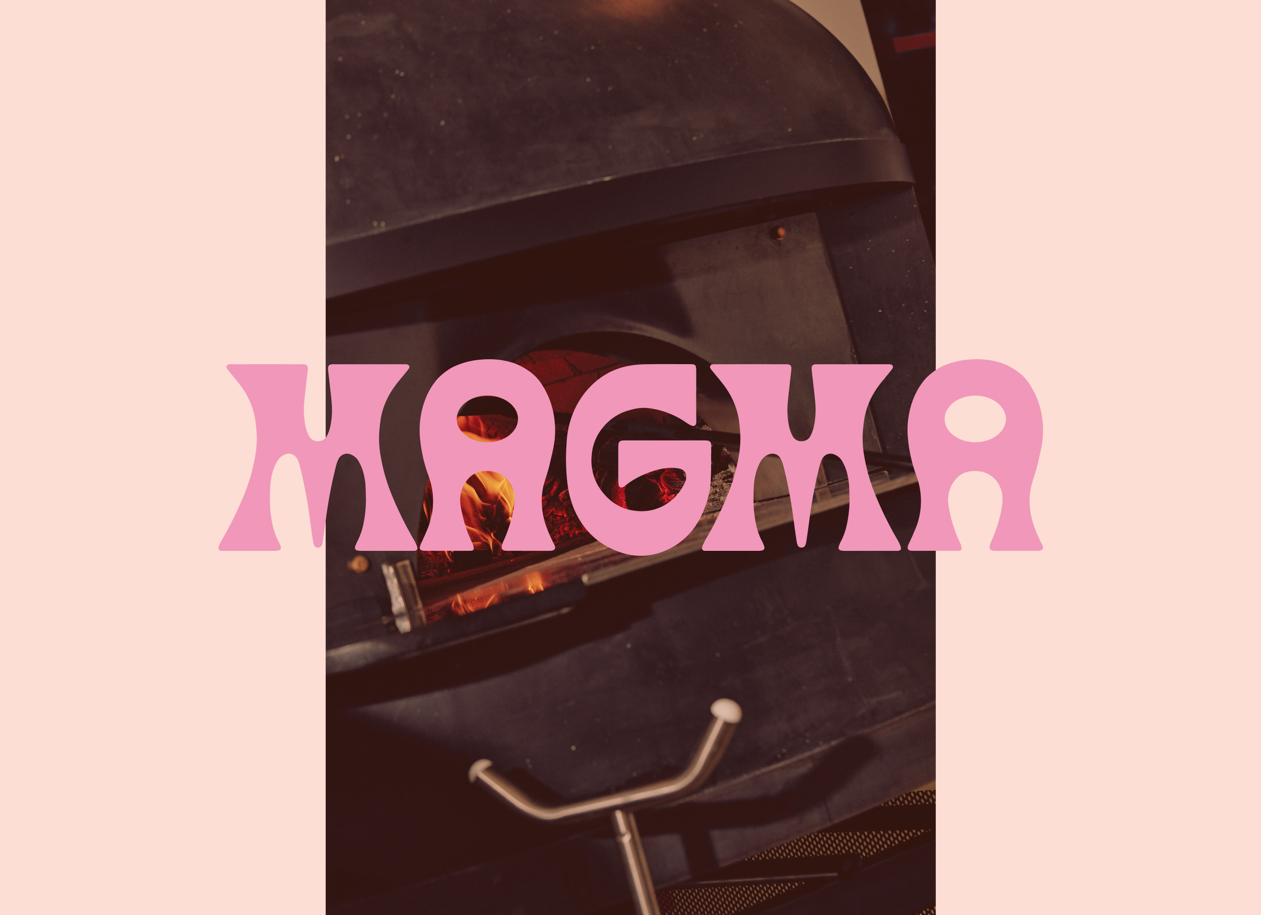 Close-up of the wood-fired pizza oven, with pink text overlay that reads "Magma"