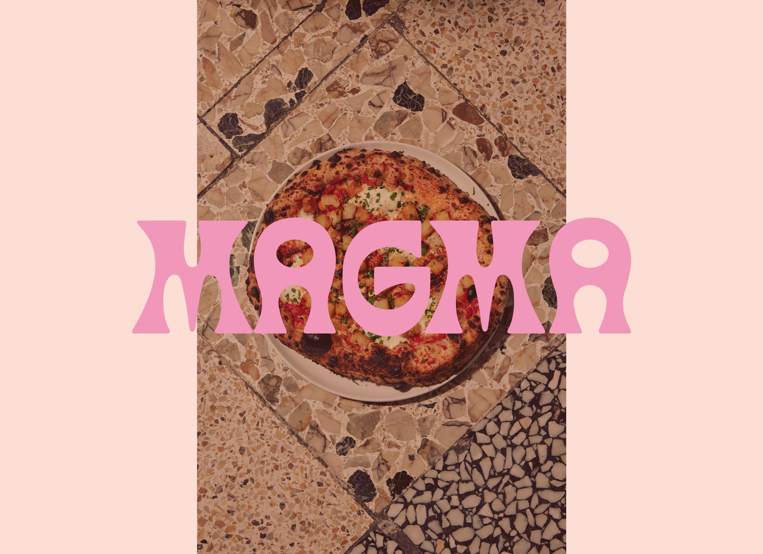 A Pizzeria Magma pizza placed on a patterned marble or terrazzo surface, with pink text overlay that reads "Magma"