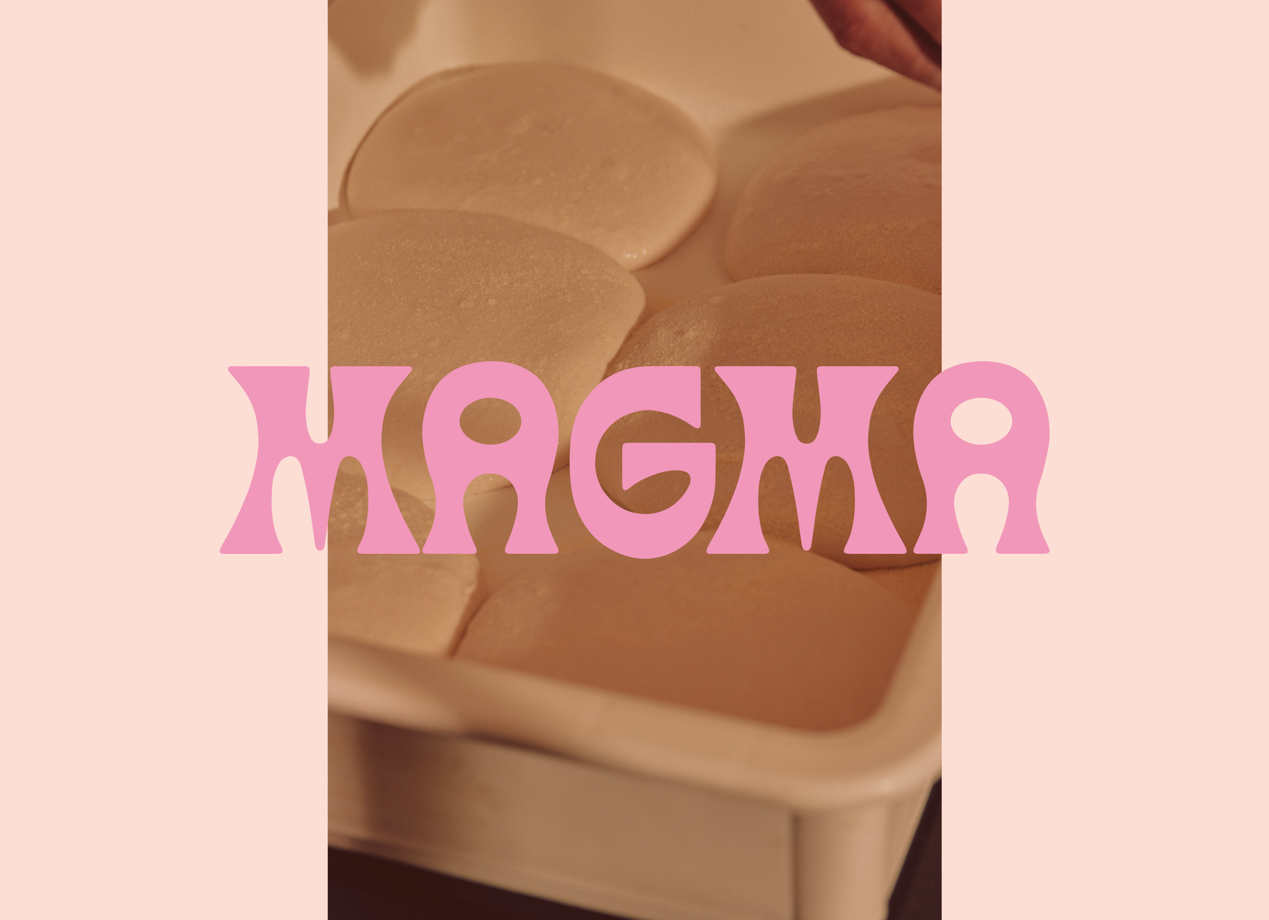 Close-up of a tray of pizza dough, with pink text overlay that reads "Magma"