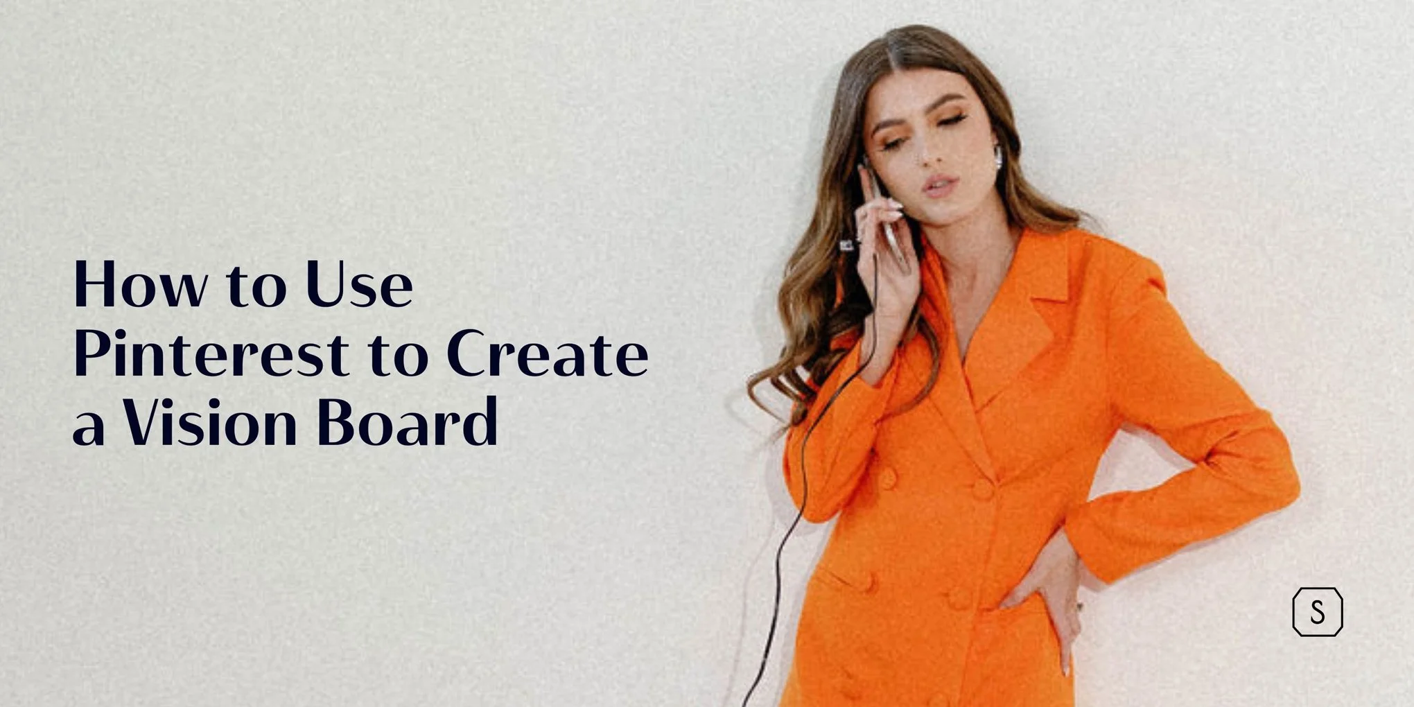 image of Chelsea Scott wearing an orange blazer while talking on a mobile phone in front of a light gray background and the text How to Use Pinterest to Create a Vision Board