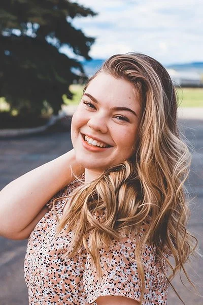 A headshot of Adele - Social Media Strategist