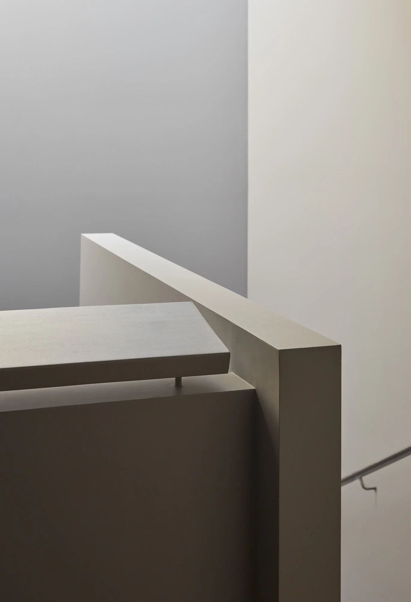 Sculptural stair balustrade with refined detailing and soft natural light.