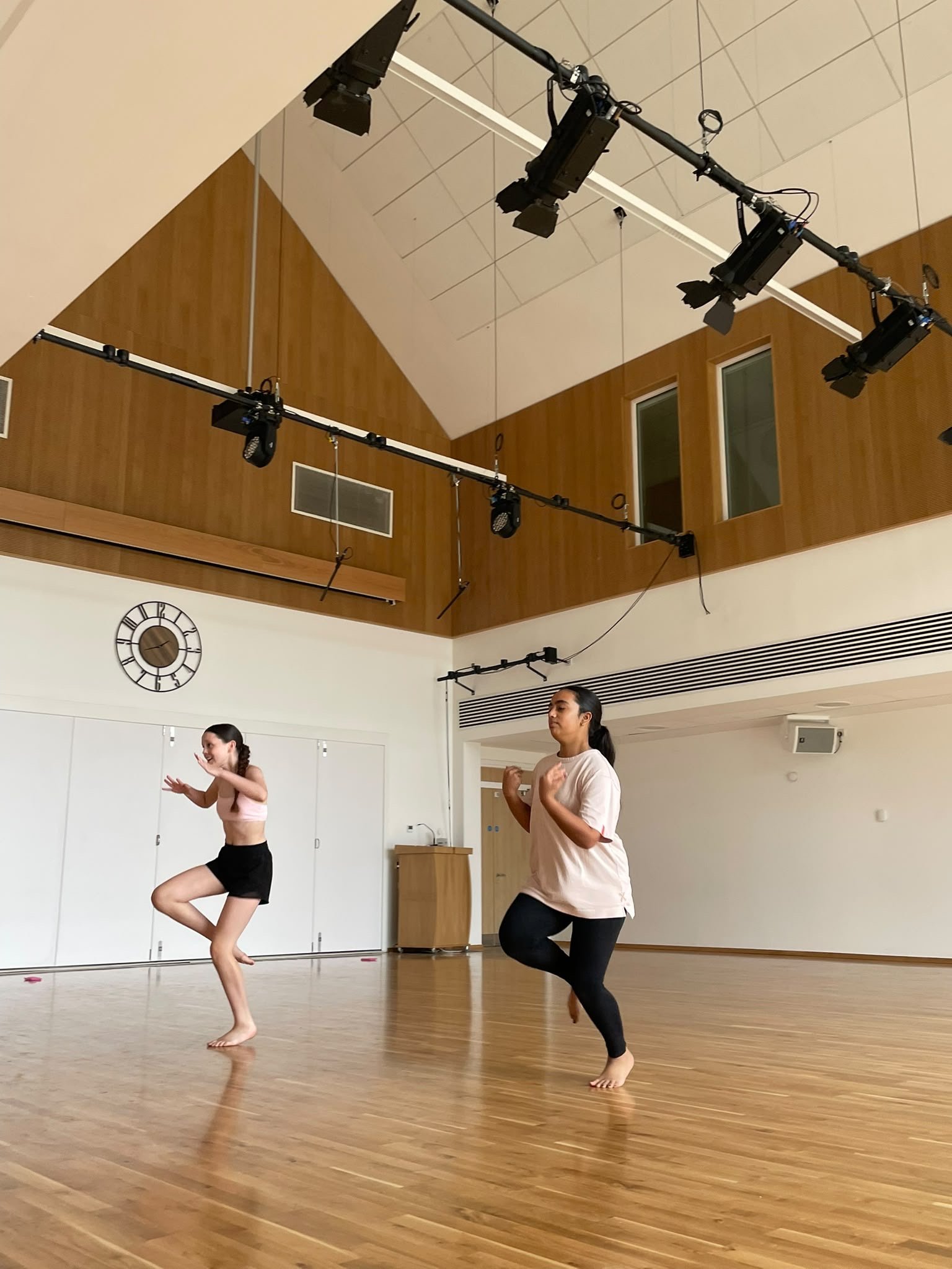 teesdance-summer-school-2026-14-two-dancers-arms-wide-theatre-space.jpg