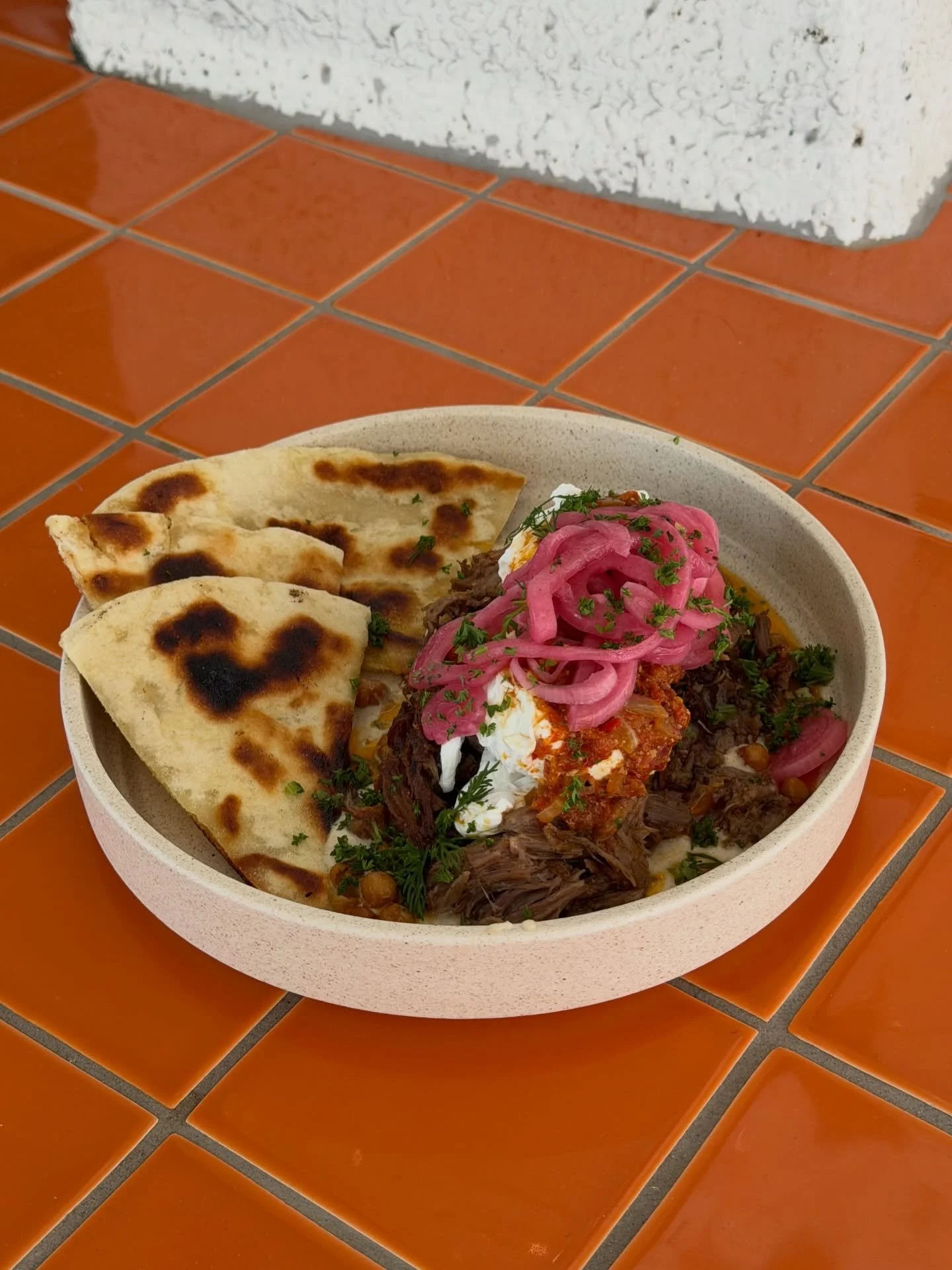 A crowd favourite &mdash; Turkish eggs + confit lamb (slow cooked for six hours) is the perfect combo. 

Tag someone you want to get breakfast with at Kefi this weekend 🧡

#turkisheggs #breakfast #yum #goldcoastcafe