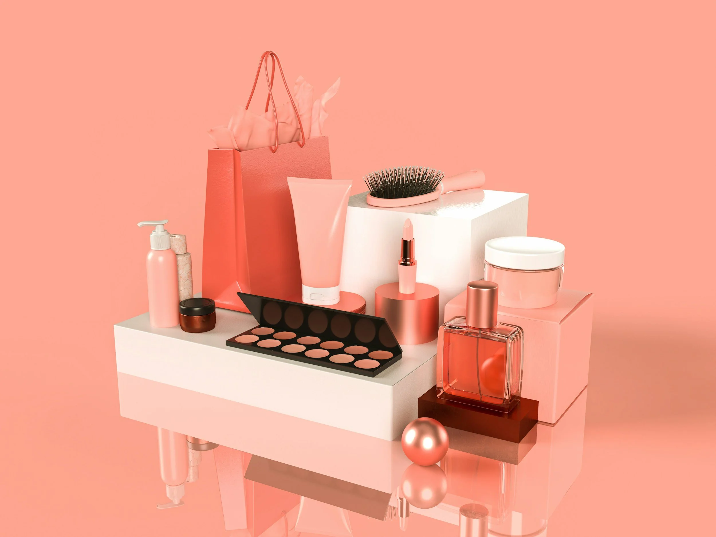 A variety of pink makeup and skincare products arranged on a white and brown platform, including bottles, cream jars, an eyeshadow palette, a lipstick, a hairbrush, and decorative spheres and blocks, all against a pink background.