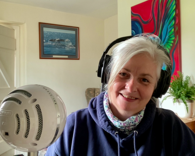 Annie sits with headphones on and mic at the ready to record the latest meditation or breathwork session to share with you. She is smiling because she knows how much benefit this brings to Mamas To Be
