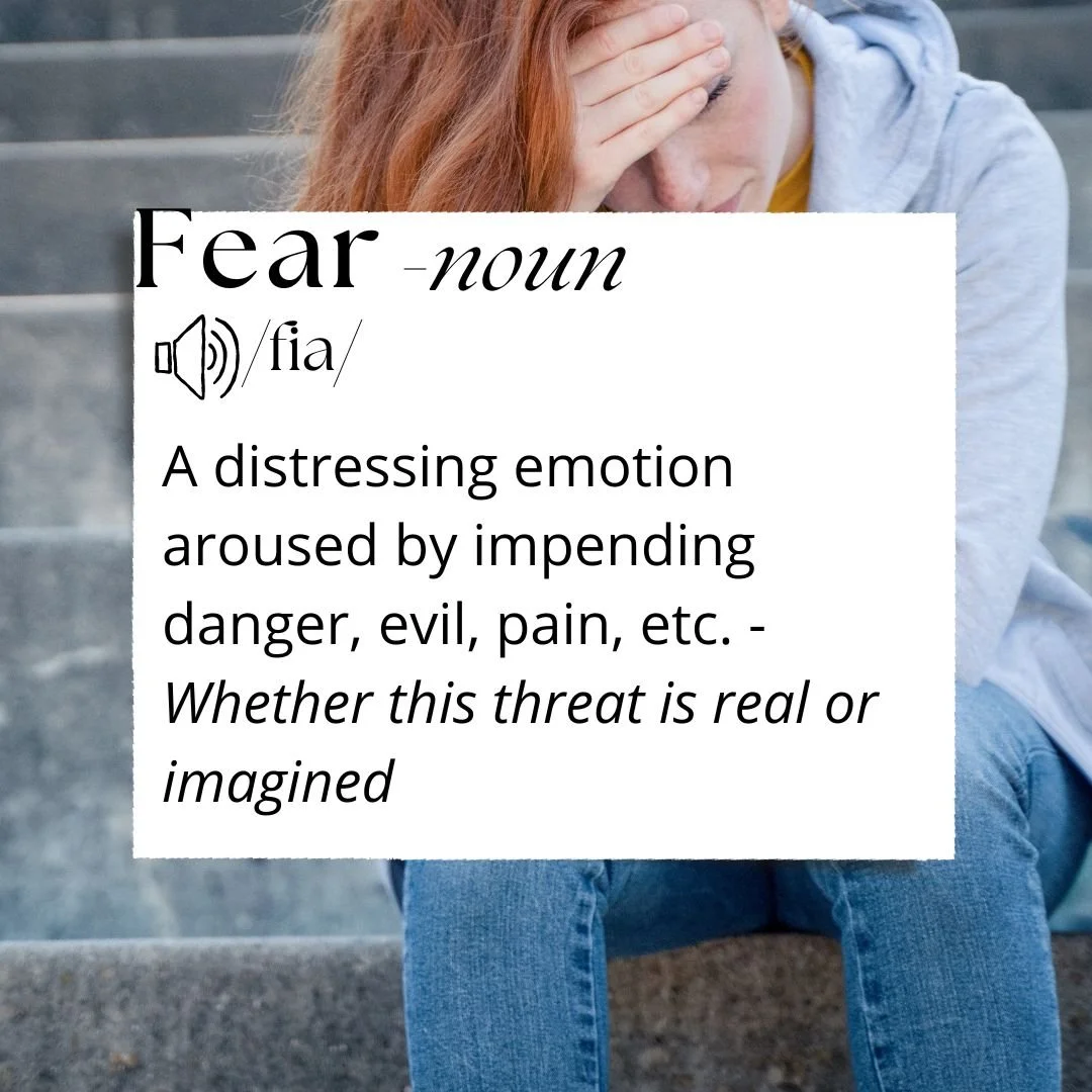 Image of red haired young woman sitting with her head in her hands as though mentally processing some emotion. Text reads : Fear - a distressing emotion aroused by impending danger, evil, pain etc - whether this threat is real or imagined