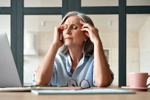 Woman experiencing tinnitus
