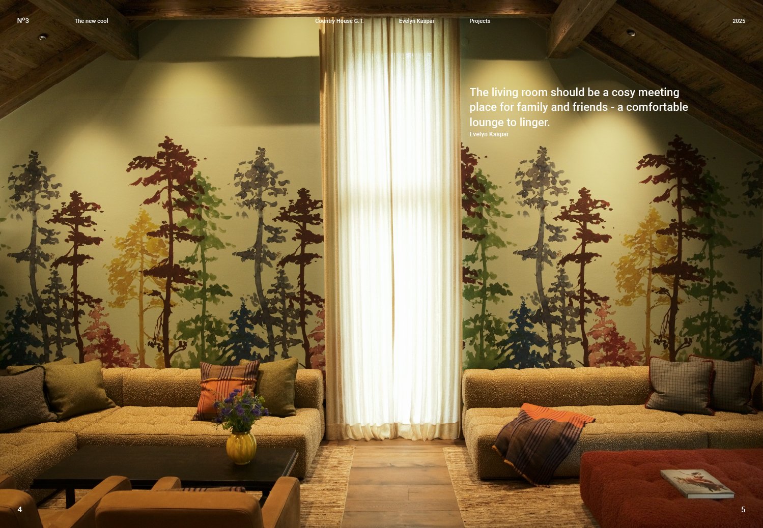 Living room with two beige sofas decorated with pillows, a coffee table with a flower vase, a wall mural of colorful trees, and a window with curtains allowing light into the room.