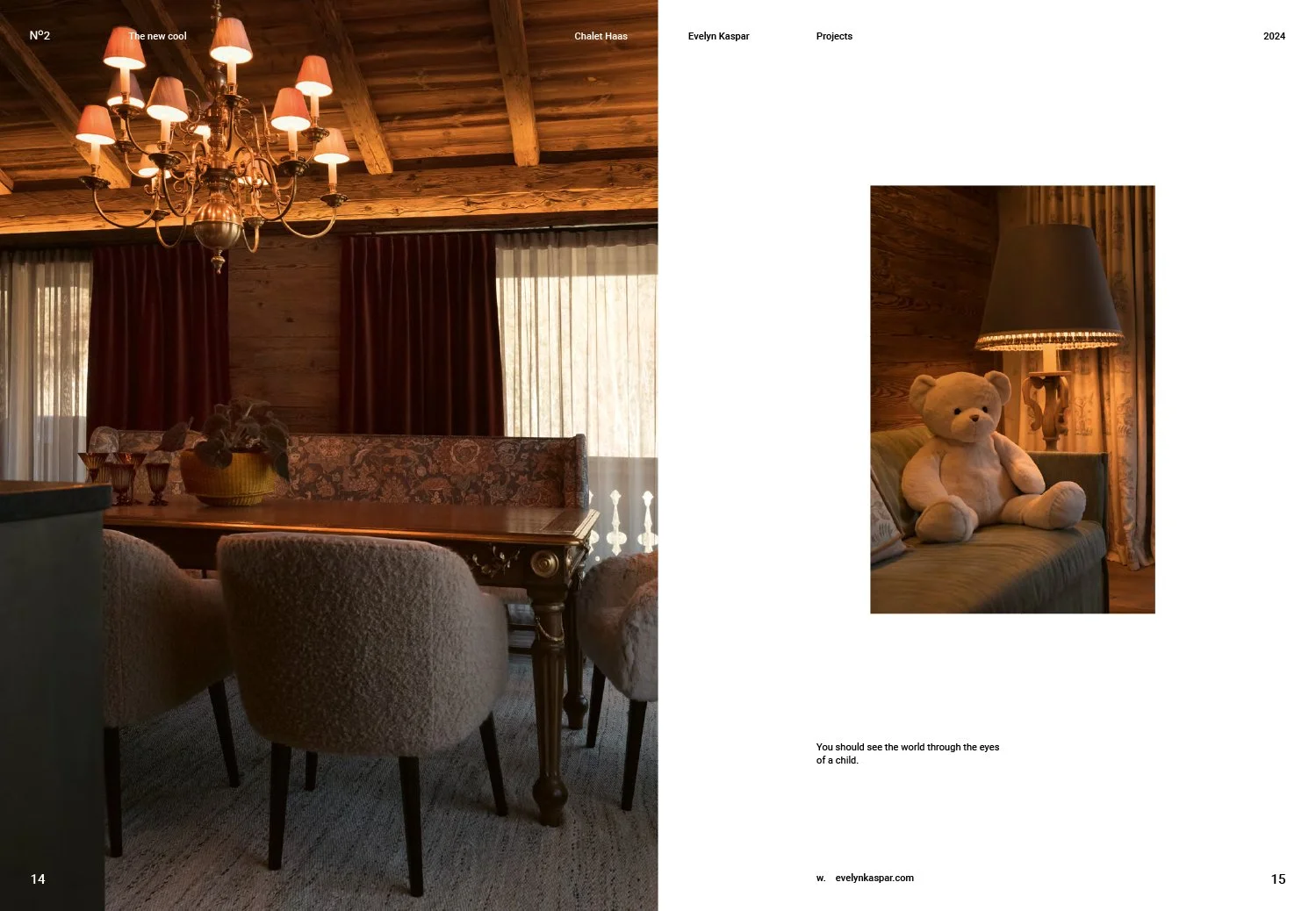 Interior of a rustic wooden room with a chandelier, wooden dining table, upholstered chairs, and a sofa with a teddy bear and a floor lamp.