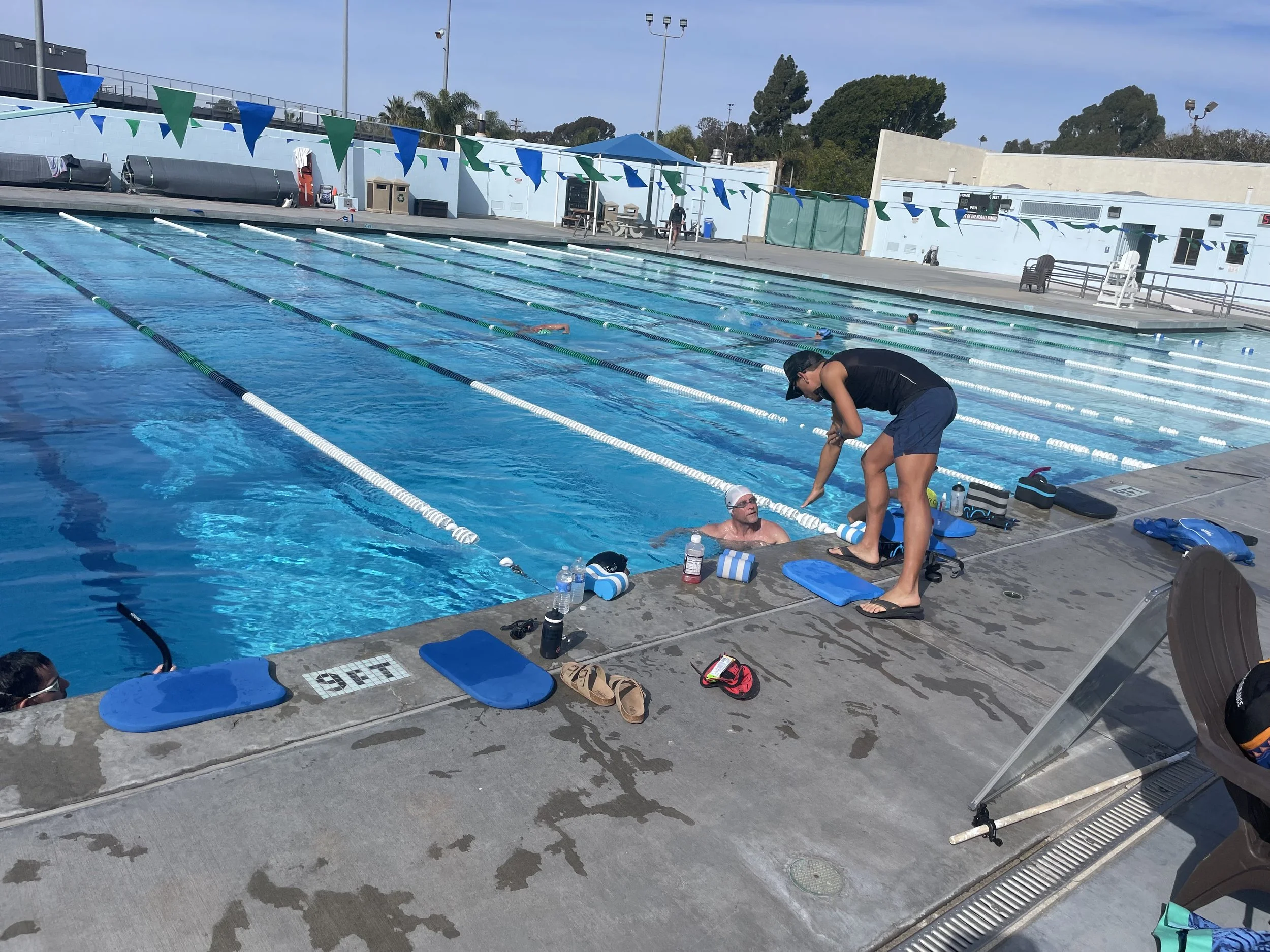 Kevin providing coaching advice on the pool deck