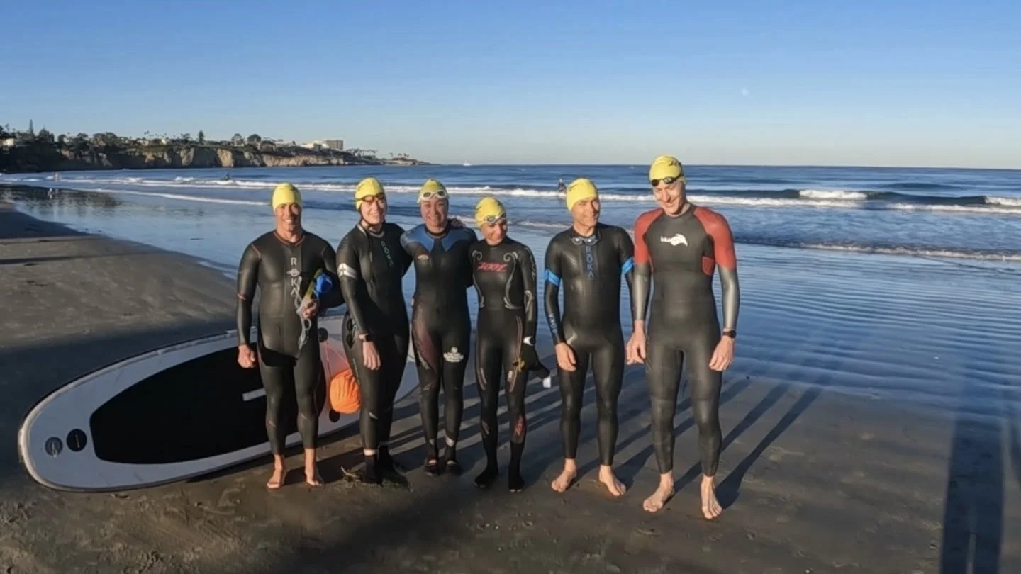 Swimmers at an open water swim practice during a tri camp